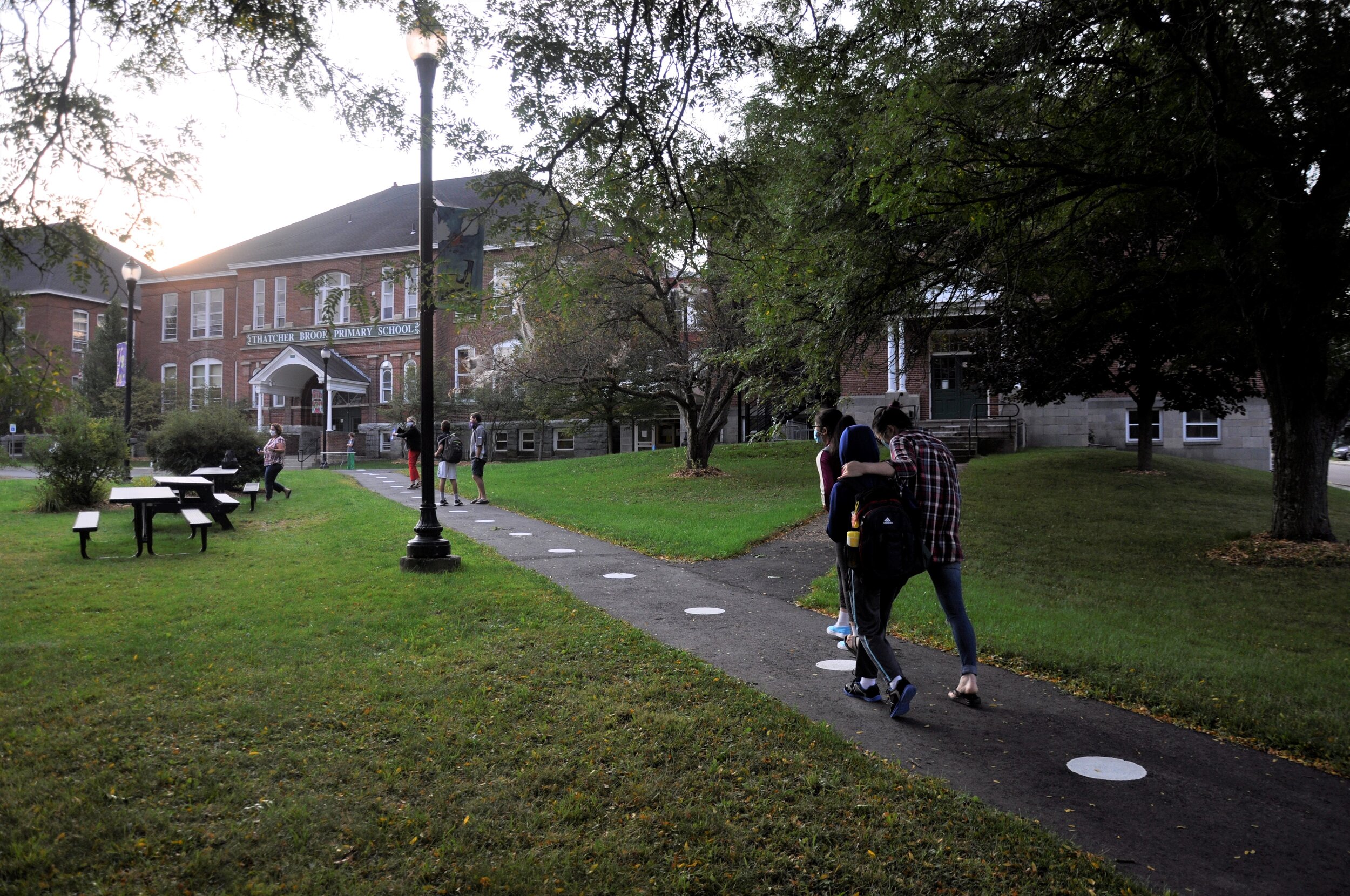   Most students arrived at Thatcher Brook Primary School with a parent or two. Walking was popular among those who lived nearby and those who decided to park and walk to skip waiting in a car line. Photo by Lisa Scagliotti.  