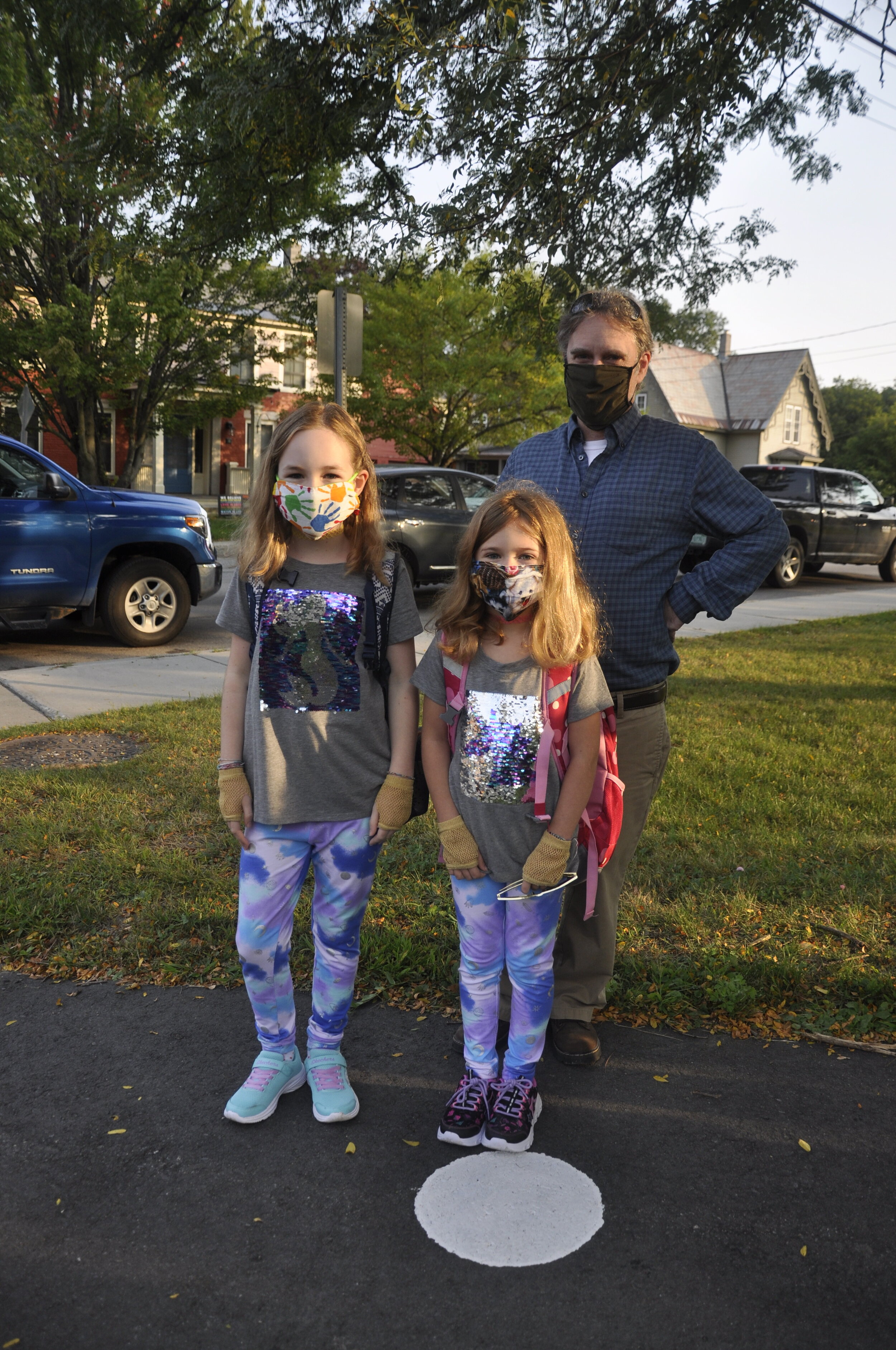   The Boyle sisters Vivienne and Josie rock their sequined mermaid and unicorn shirts as they head to their first day of 4th and 2nd grade with dad, Rick, along for the walk. In a nod to the normal, many youngsters arrived in new sneakers and t-shirt