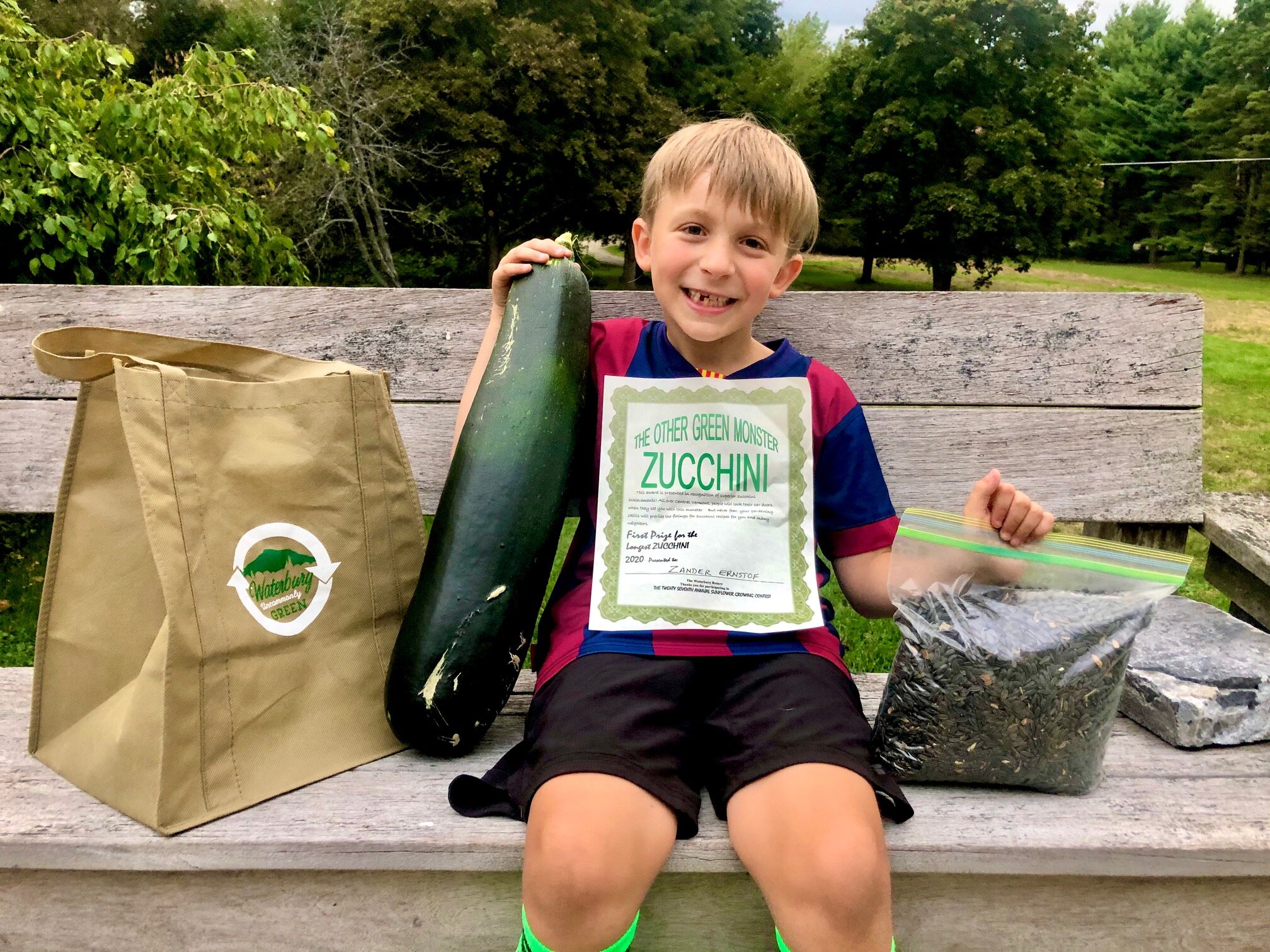 Zander Ernstof displays his winning zucchini with his prizes. Courtesy photo.