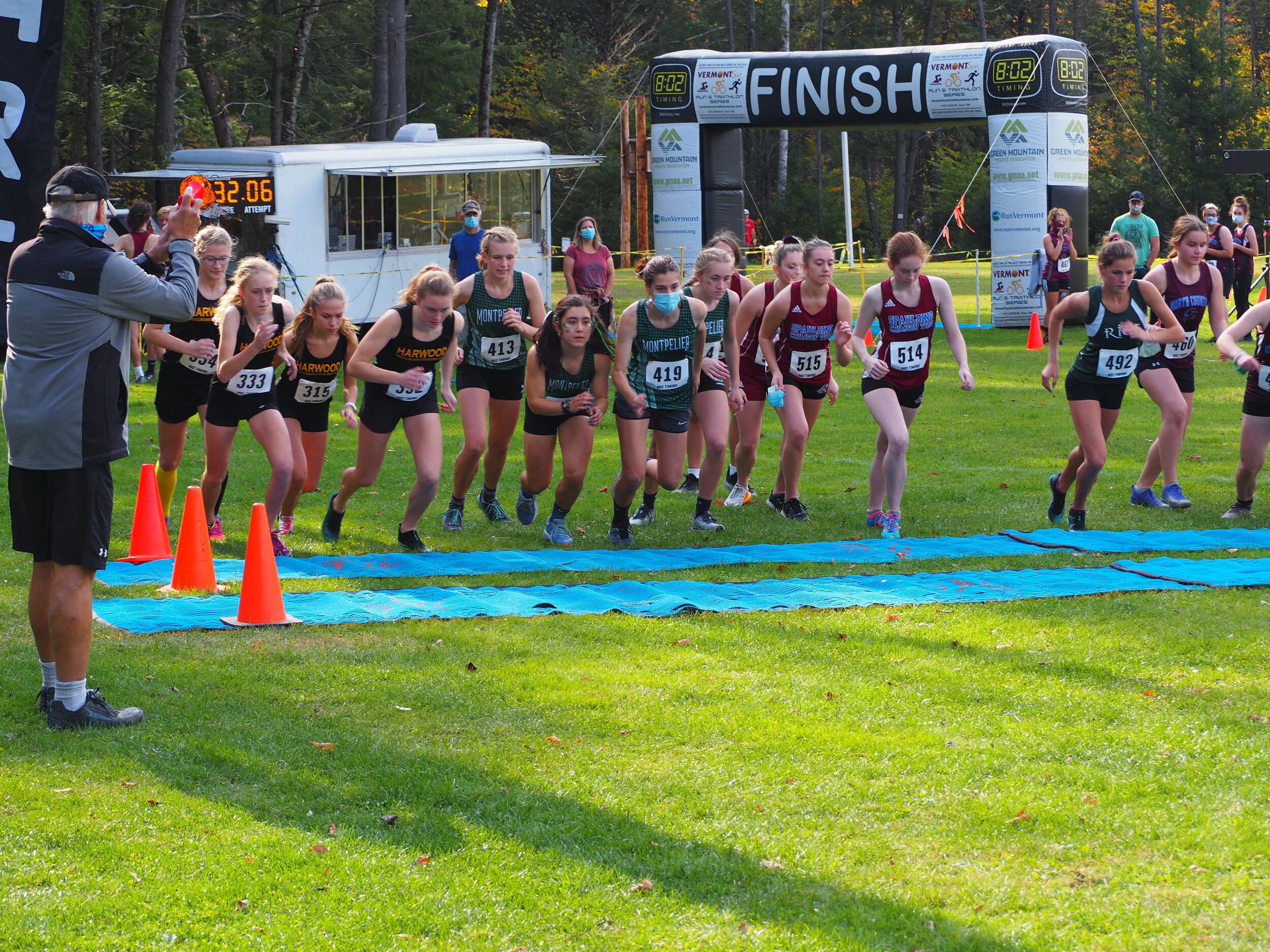   Harwood varsity girls runners at the start, left to right: Britta Zetterstrom, Julia Thurston, Charlie Flint, Ava Thurston. Photo by Ann Zetterstrom.  