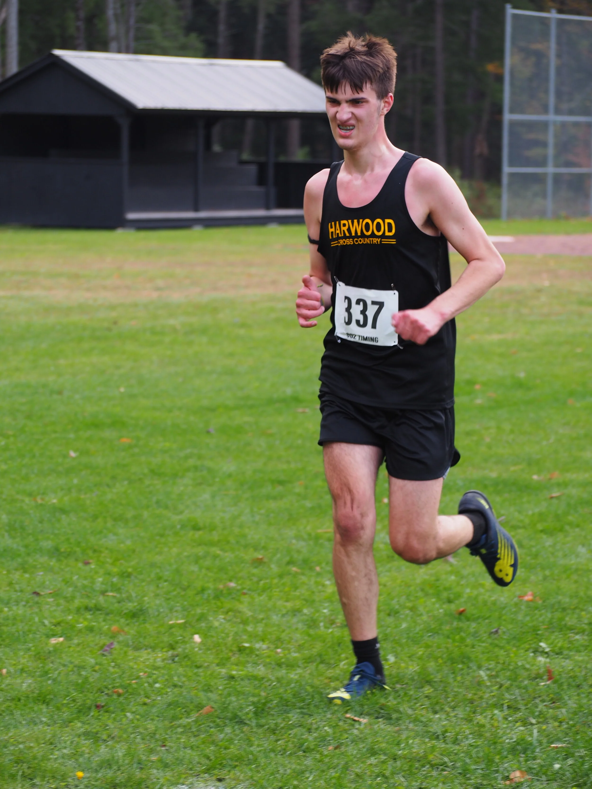   JV runner Jonah Busker pushes on. Photo by Ann Zetterstrom.  