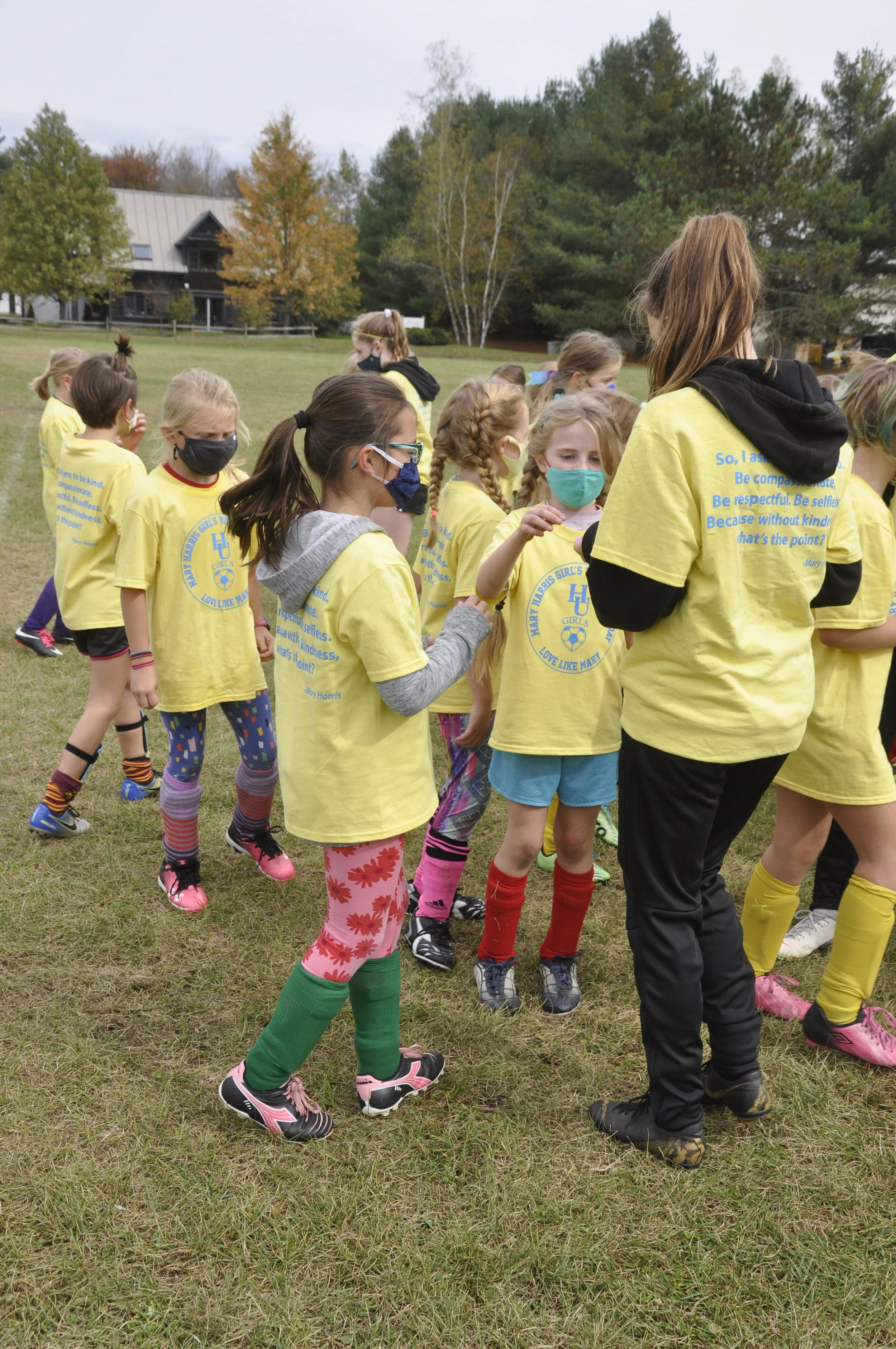   High school players hand out candy to the youngsters at the end of their training time. Photo by Lisa Scagliotti.  