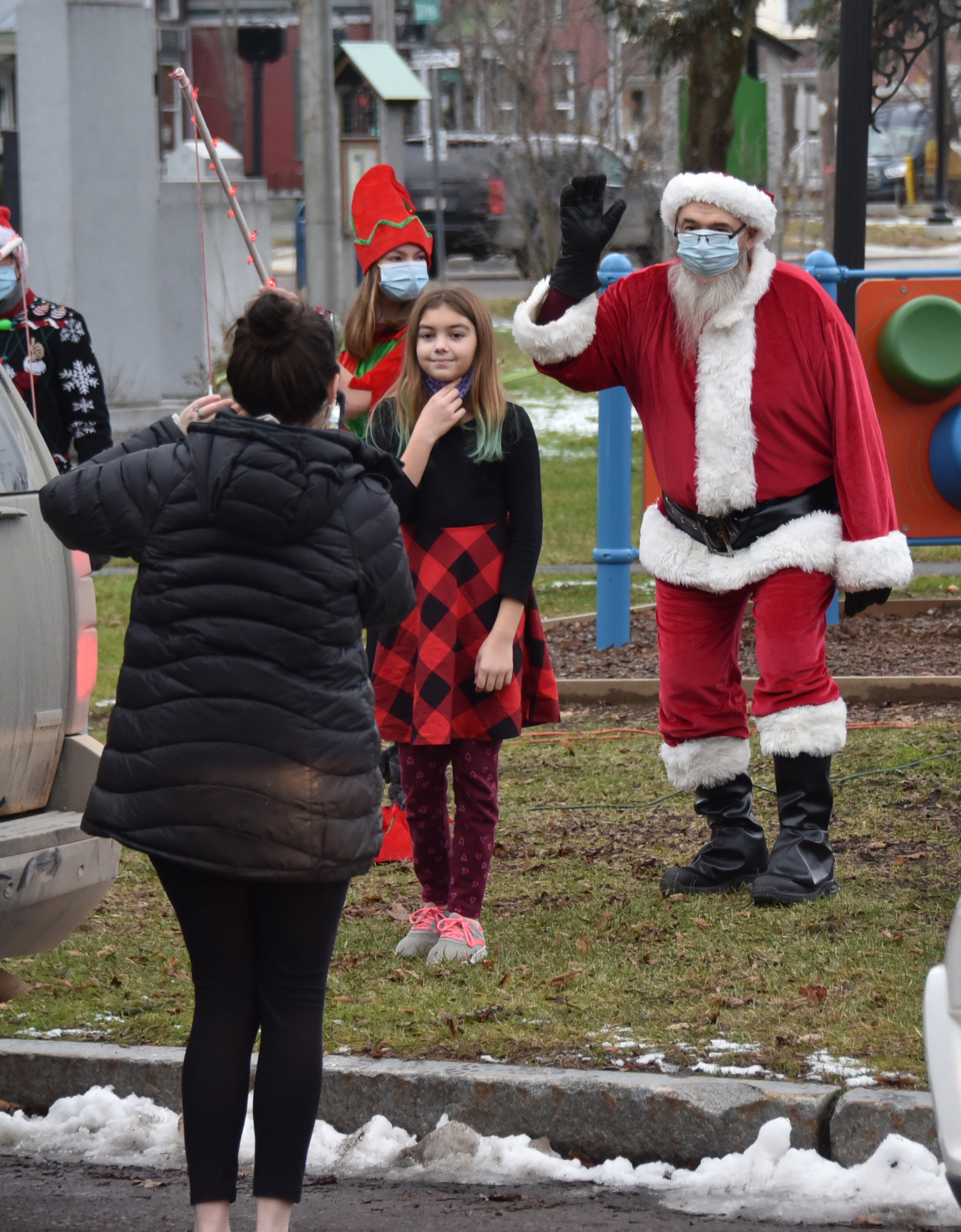   Quick hop out of the car for a photo with Santa at a distance. Photo by Gordon Miller.  