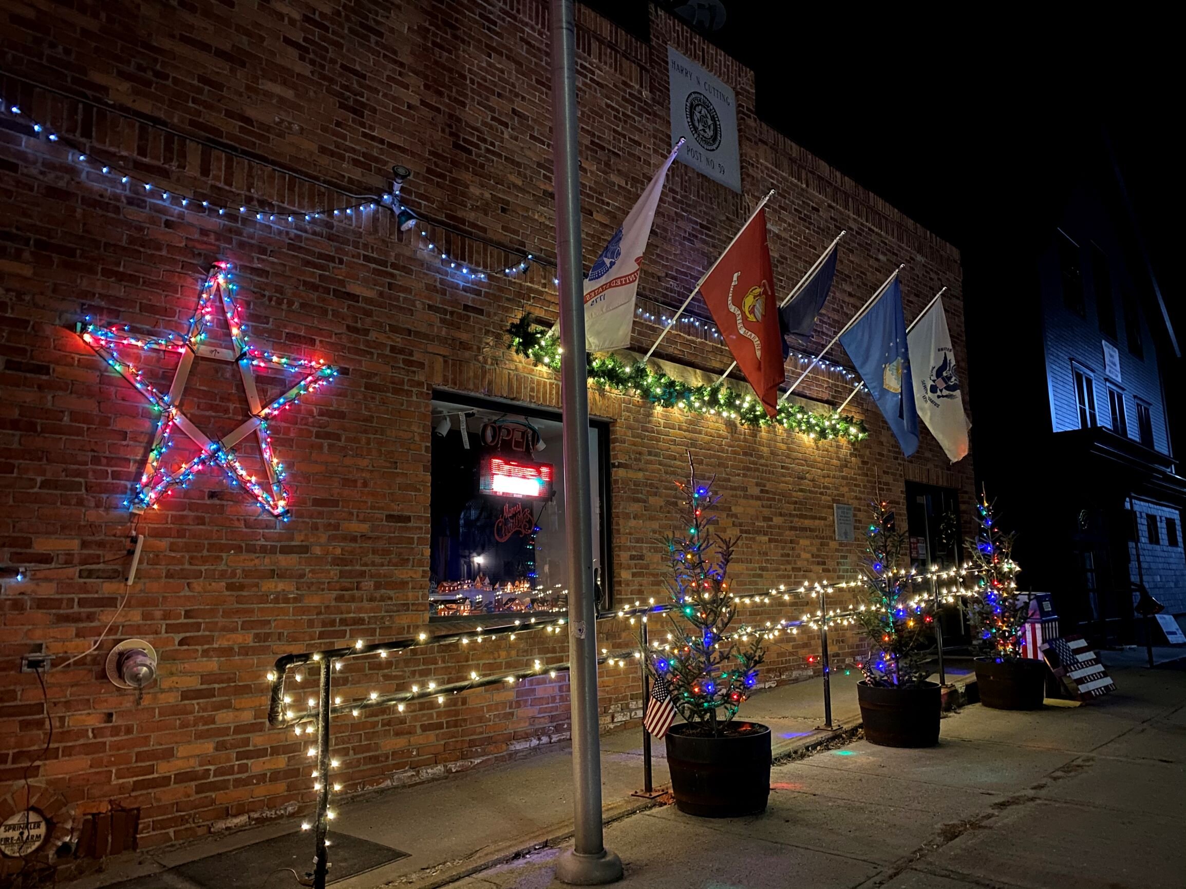   The Americal Legion Post 59 lights up its section of Stowe Street. Photo by Gordon Miller.   