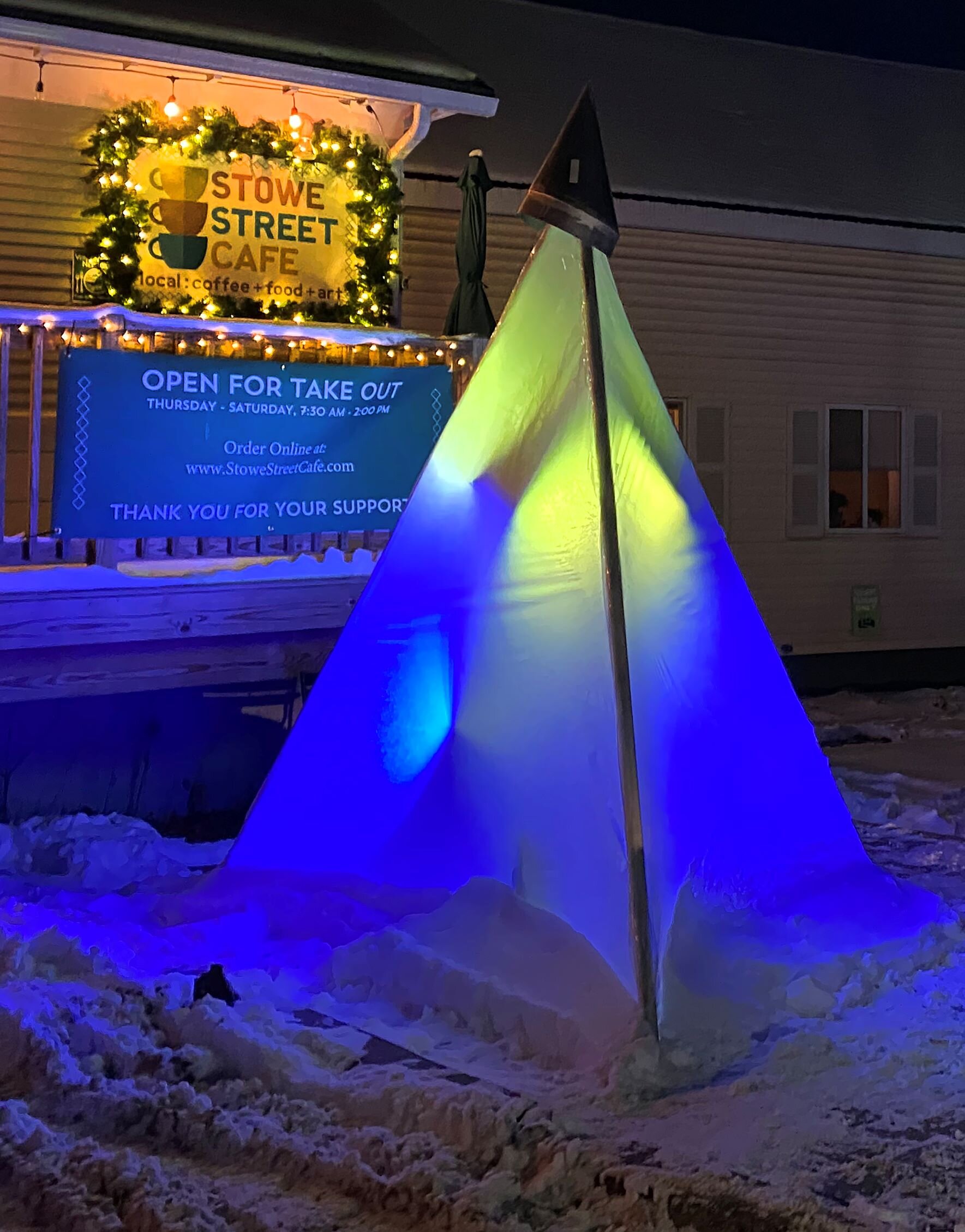   The glowing pyramid titled "Trichotomy" that John Bauer created for River of Light has a new home outside Stowe Street Café. Photo by Gordon Miller.  
