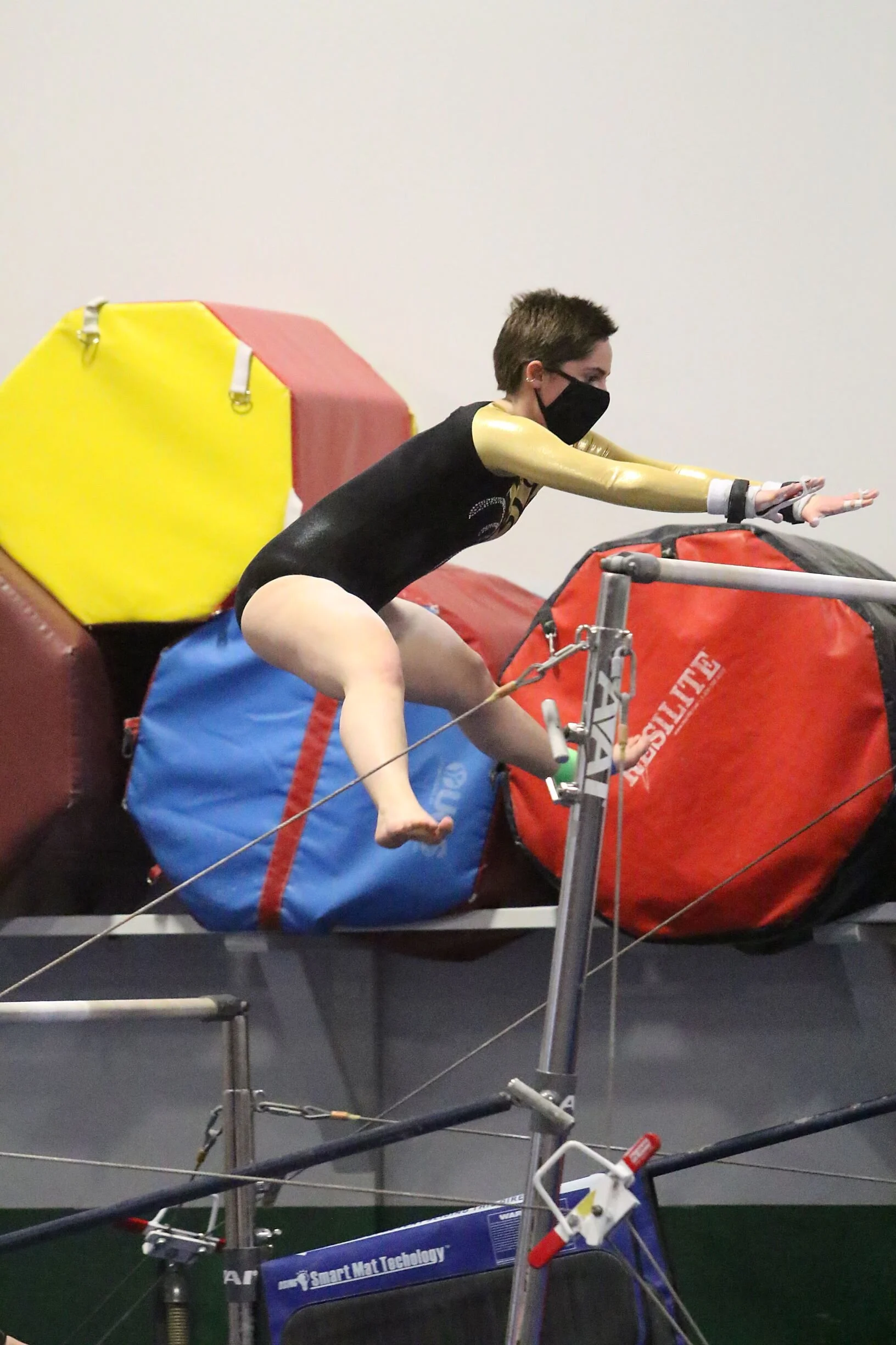  Sophomore Olivia Bloom flies through her routine on bars.  Photo by Paul Lamontagne/VtSportsImages.com 