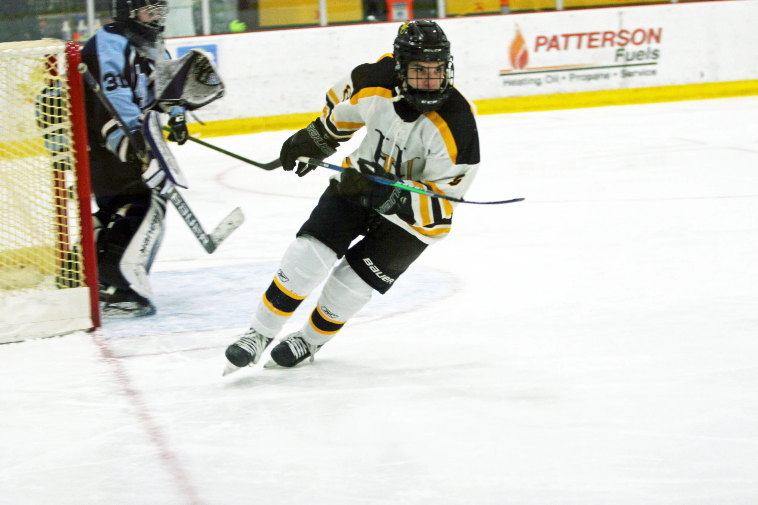  Sophomore Pacie McGrath skirts the MMU goal. Photo by Brian Larrabee 