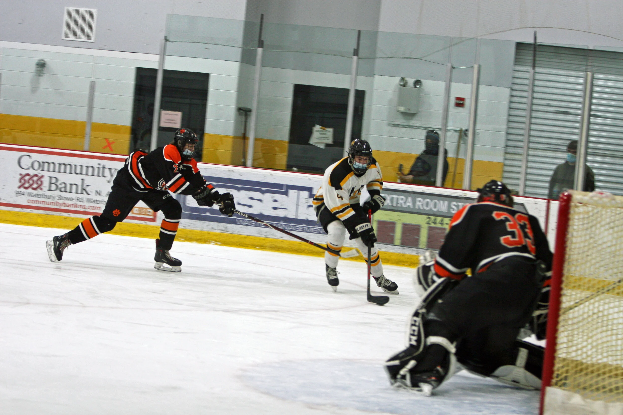  Green fights off Tigers as he maneuvers near the net. Photo by Brian Larrabee 