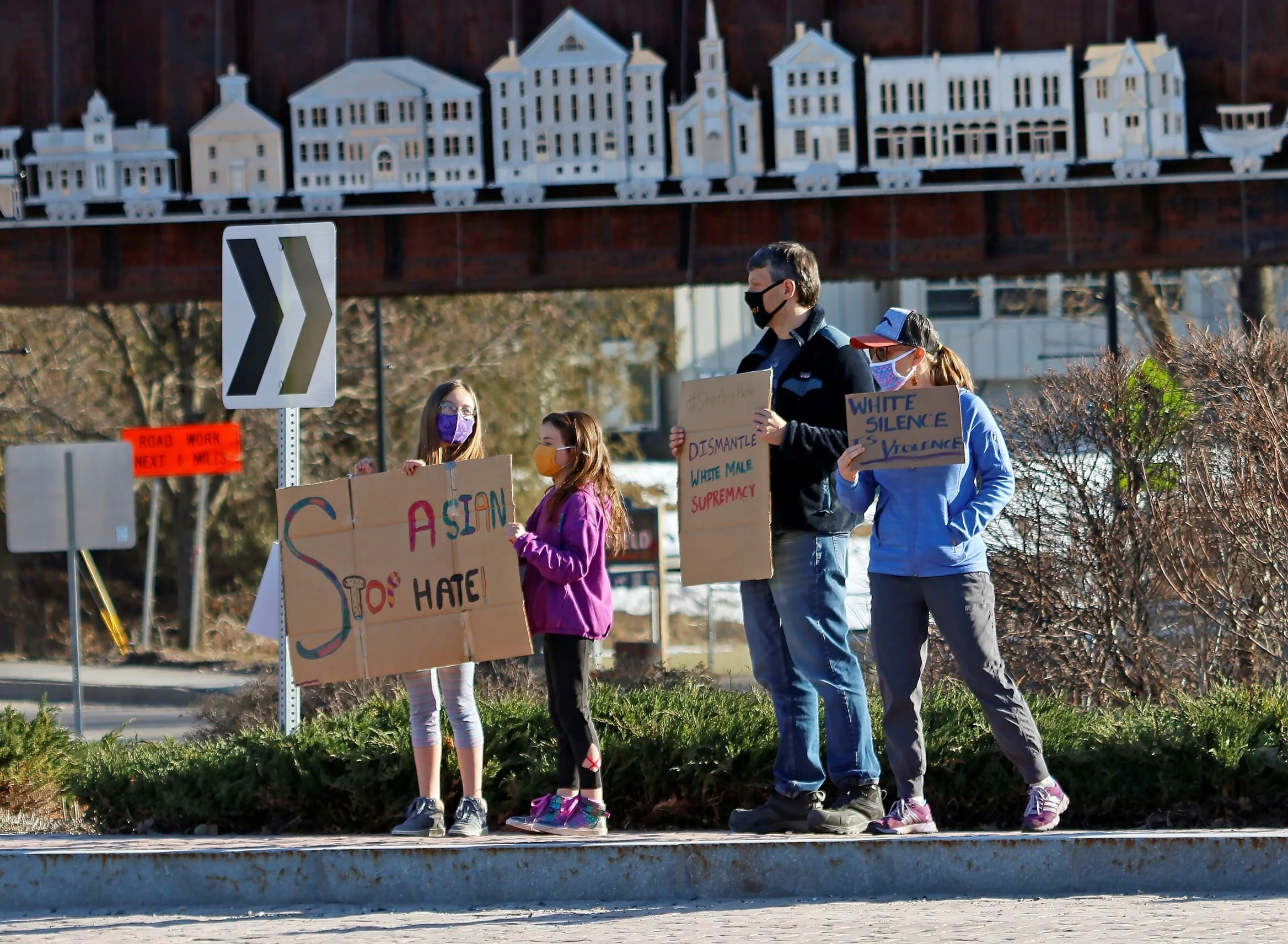  Standing at the Waterbury roundabout intersection on Sunday, March 21, local racial and social justice activists hold up signs denouncing racism and hatred against Asian, Asian American, and Pacific Islanders in the wake of the multiple shootings in