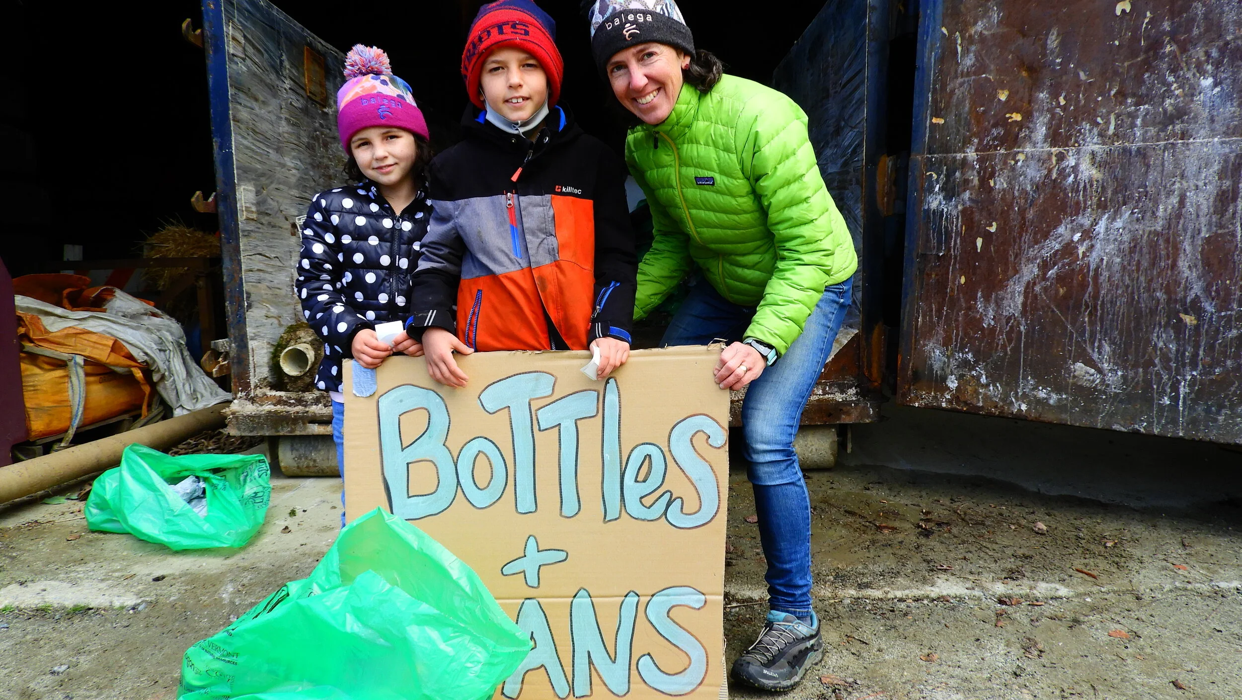  Caitlin Hollister and her kids Susannah and Jacob Rye drop off early and add to the returnable collection. Photo by Rob Hoffmann. 