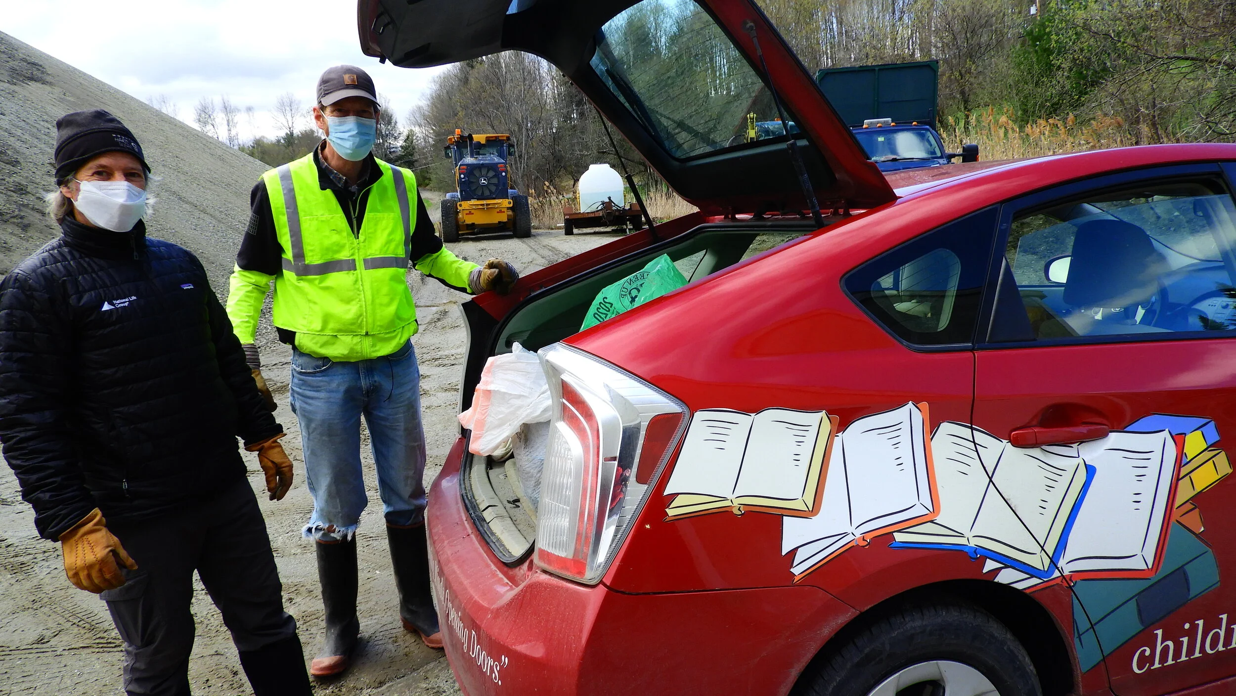  Bill Minter and Duncan McDougall unload the CLiF-mobile at the highway garage drop-off. Photo by Rob Hoffmann. 