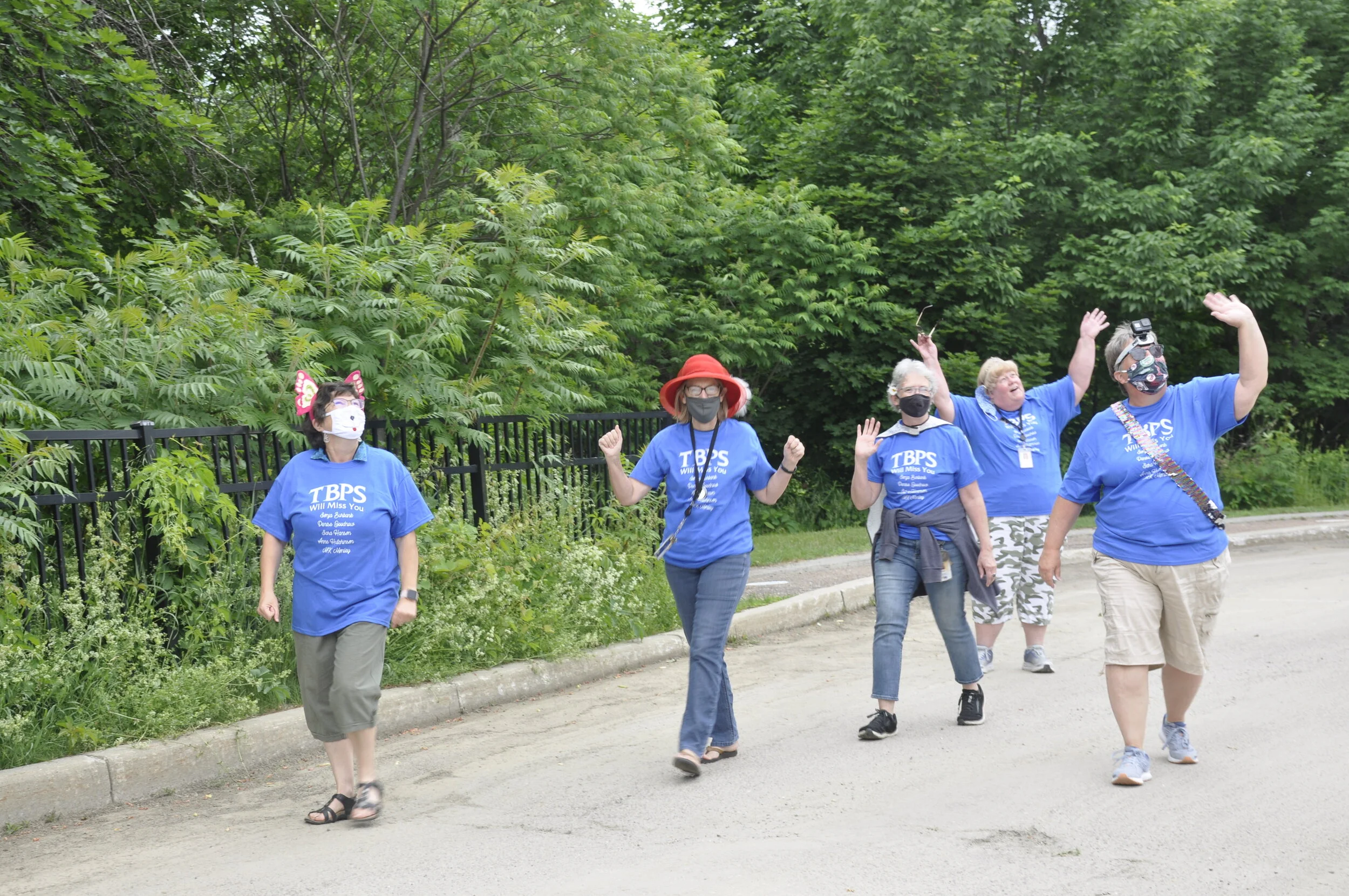  The group of retiring Thatcher Brook Primary School teachers make their way back from the end of the gauntlet and see a drone overhead snapping photos. Left to right: Sonja Burbank, Sara Hanson, MK Monley, Anne Hutchinson, Denise Goodnow. Photo by L