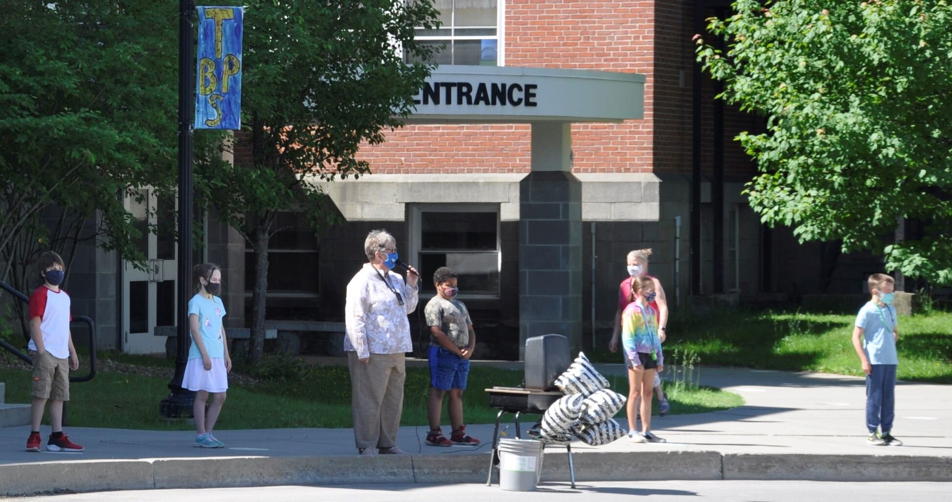  Principal Denise Goodnow, center, welcomes family members to start the short program.  Photo by Lisa Scagliotti 