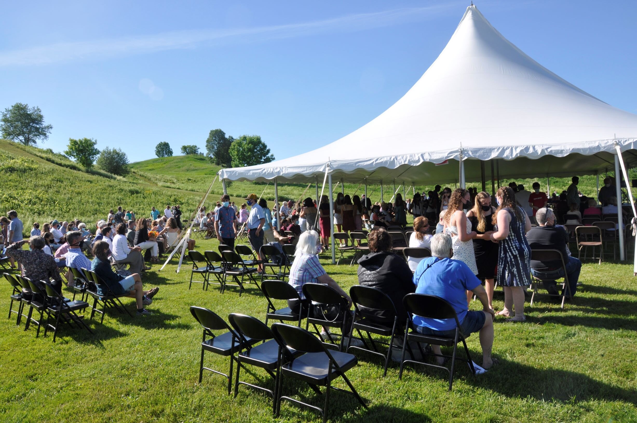  Sunshine and blue skies greet the 8th grade class and their families for Crossett Brook Middle School's first outdoor graduation on June 10. Photo by Lisa Scagliotti.  
