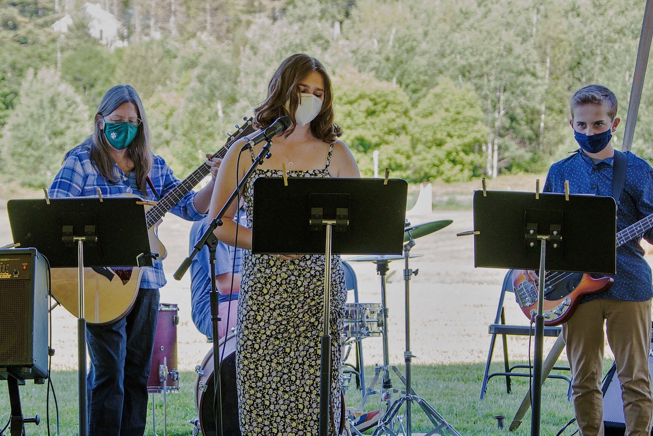   The "grad band" performs during the 8th grade graduation program. Left to right: Teacher Tammy Thompson, eighth-graders Anna Brundage and Nate Conyers; Jackson Palermo on drums behind. Photo by Sarah Milligan.  