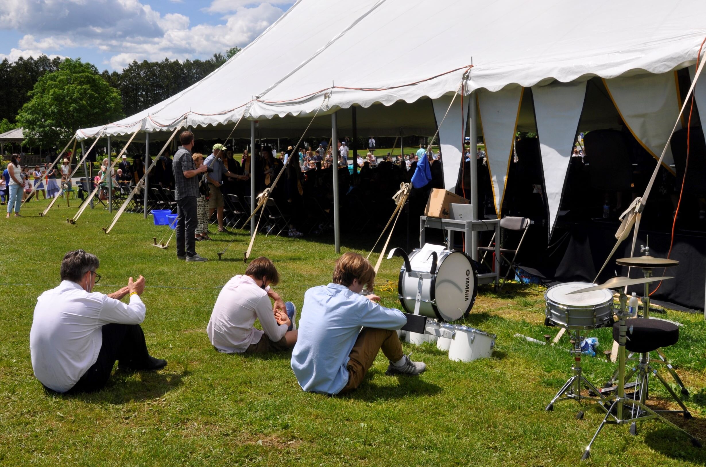  Harwood Band Director Chris Rivers awaits the final musical number with members of the Harwood Drum Line.  Photo by Lisa Scagliotti 