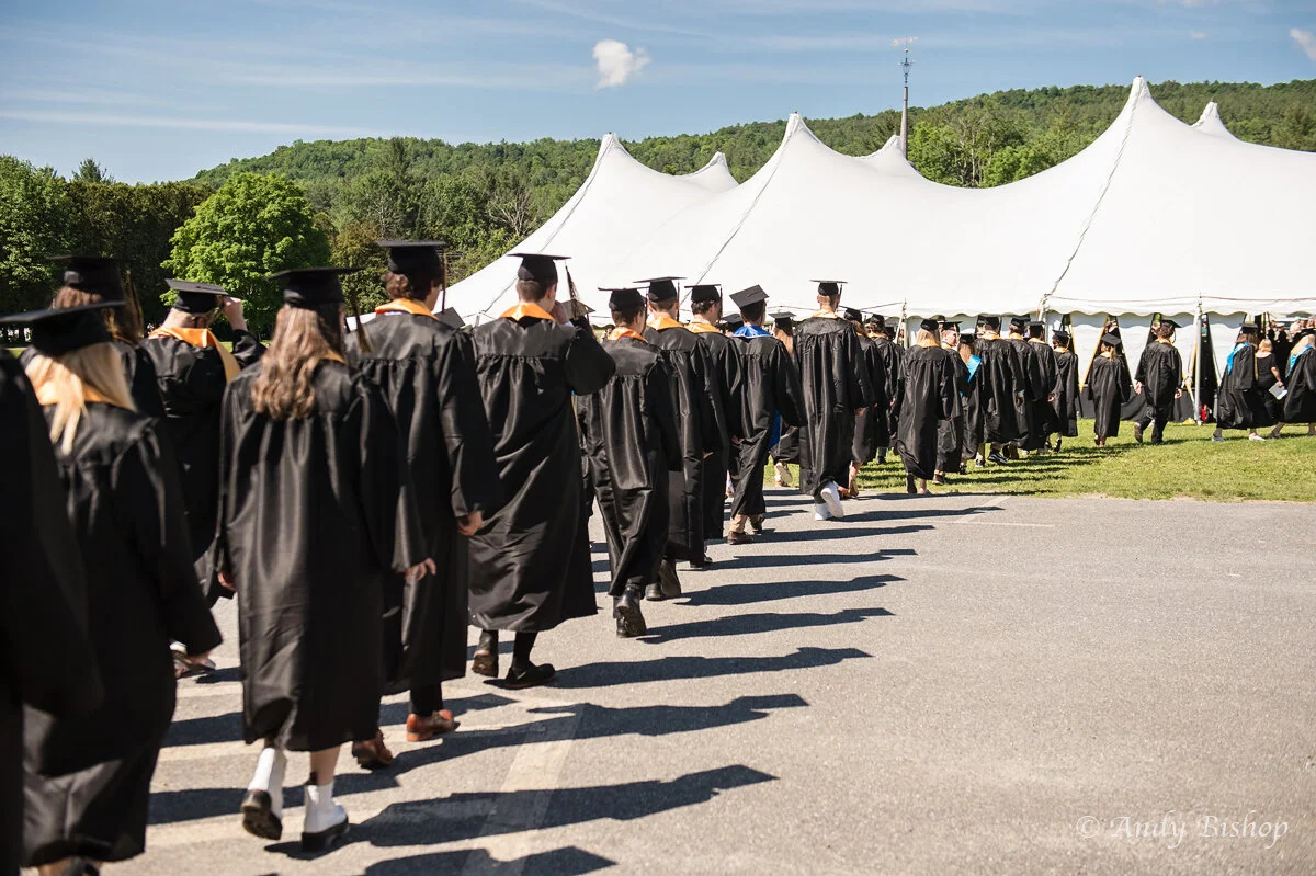 The seniors walk in under sunny skies for their final time together as the Class of 2021. Photo by Andy Bishop