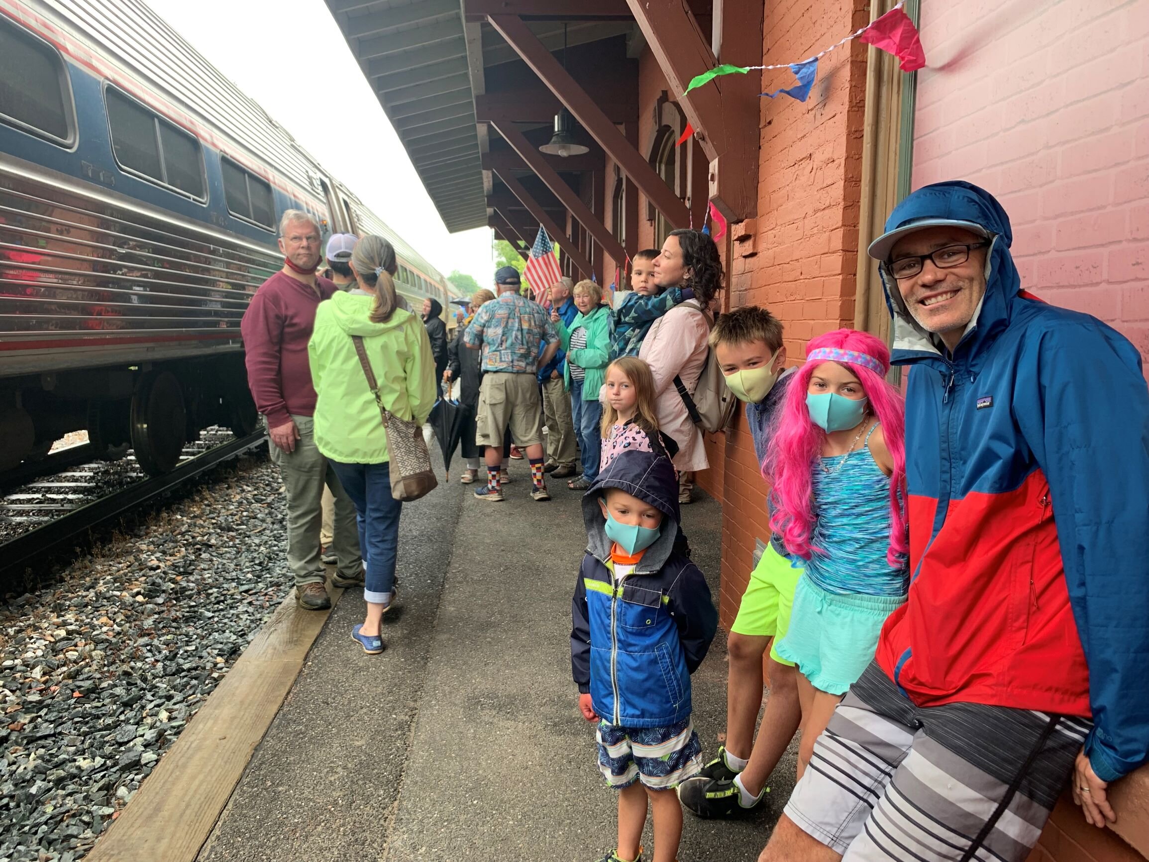   After 16 months, the answer to "Can we go see the train today?" was finally yes for Asher, Cora, Grayson, and their dad Eric Eley who took in the Amtrak arrival in Waterbury Monday morning. Photo by Lisa Scagliotti  