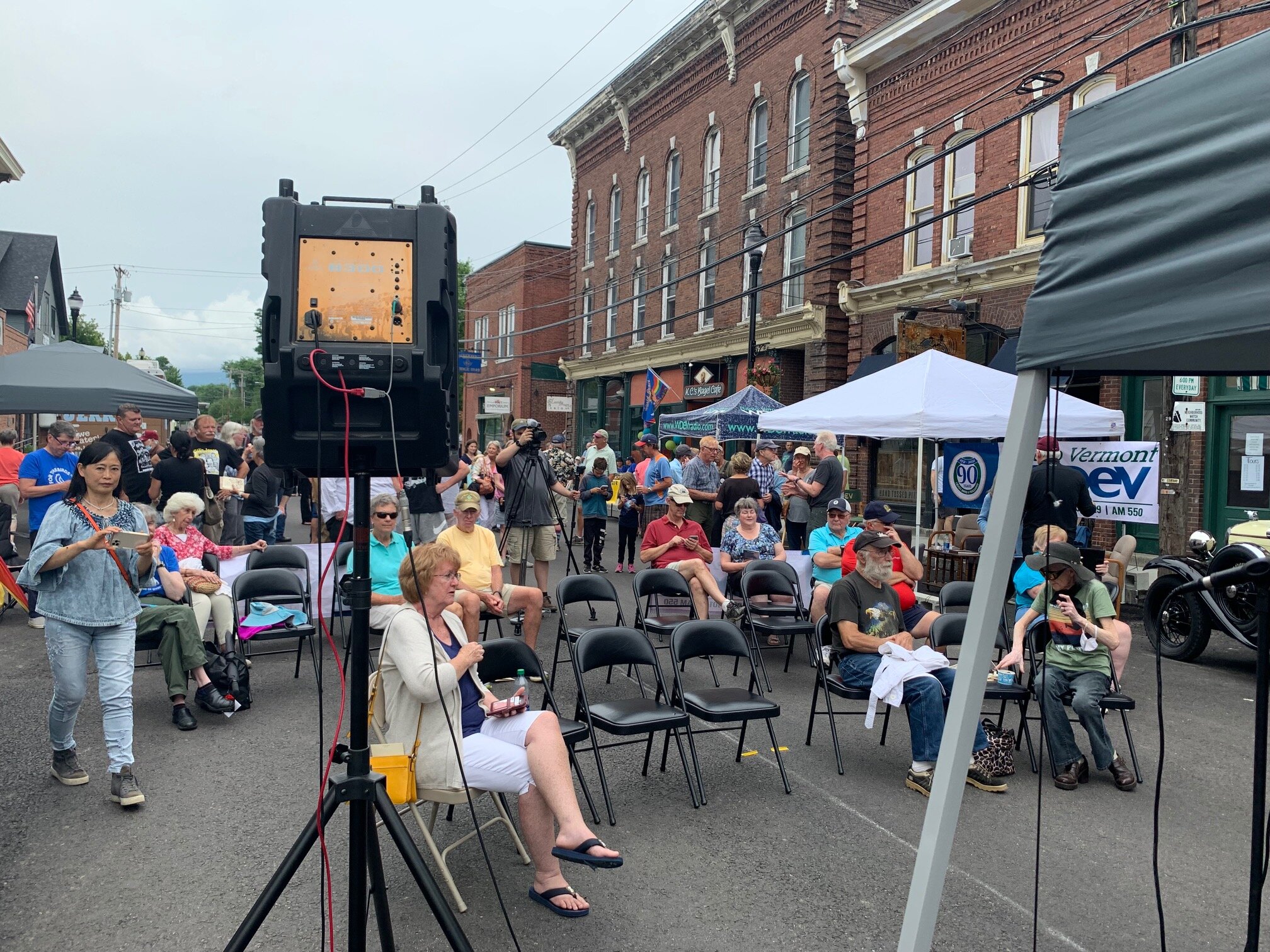   By midday, the crowd has settled in as the lower block of Stowe Street is transformed into a live radio studio. Photo by Lisa Scagliotti  