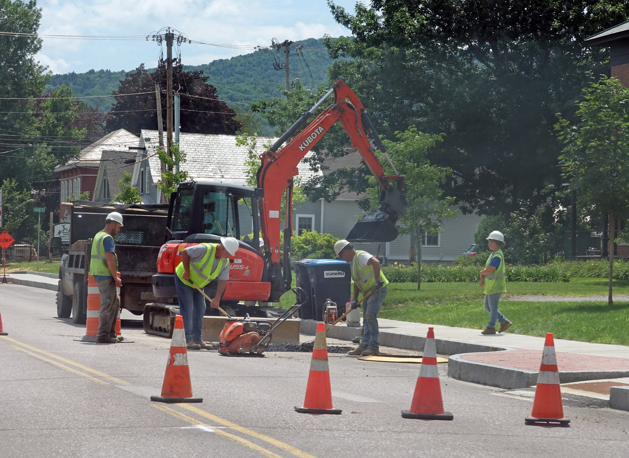   On South Main Street, workers make final adjustments to drains and other surface structures in the roadway before the final paving work commences. Photo by Gordon Miller  