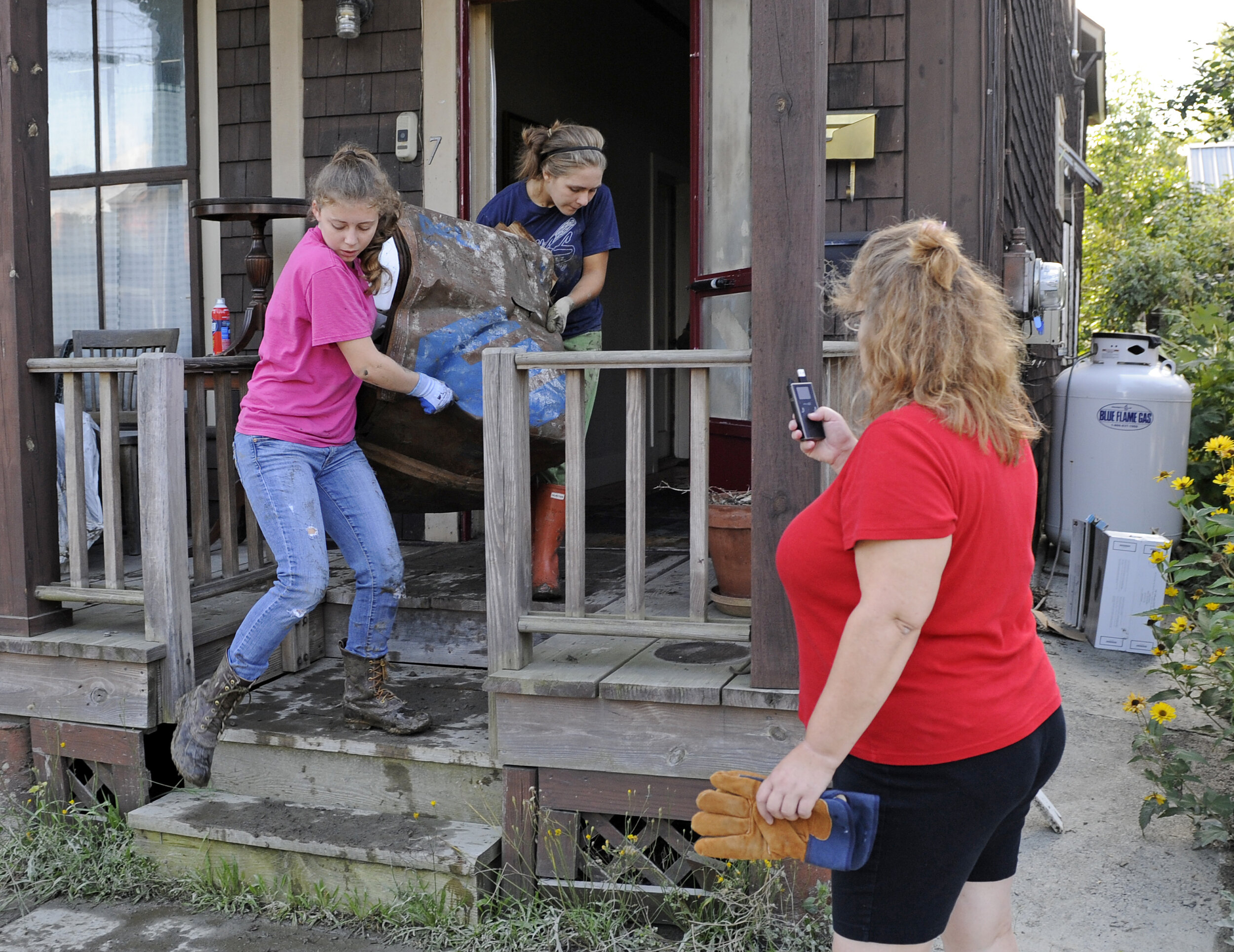  Volunteers went from home to home, in many cases meeting neighbors for the first time before helping haul possessions outside. Photo by Gordon Miller 