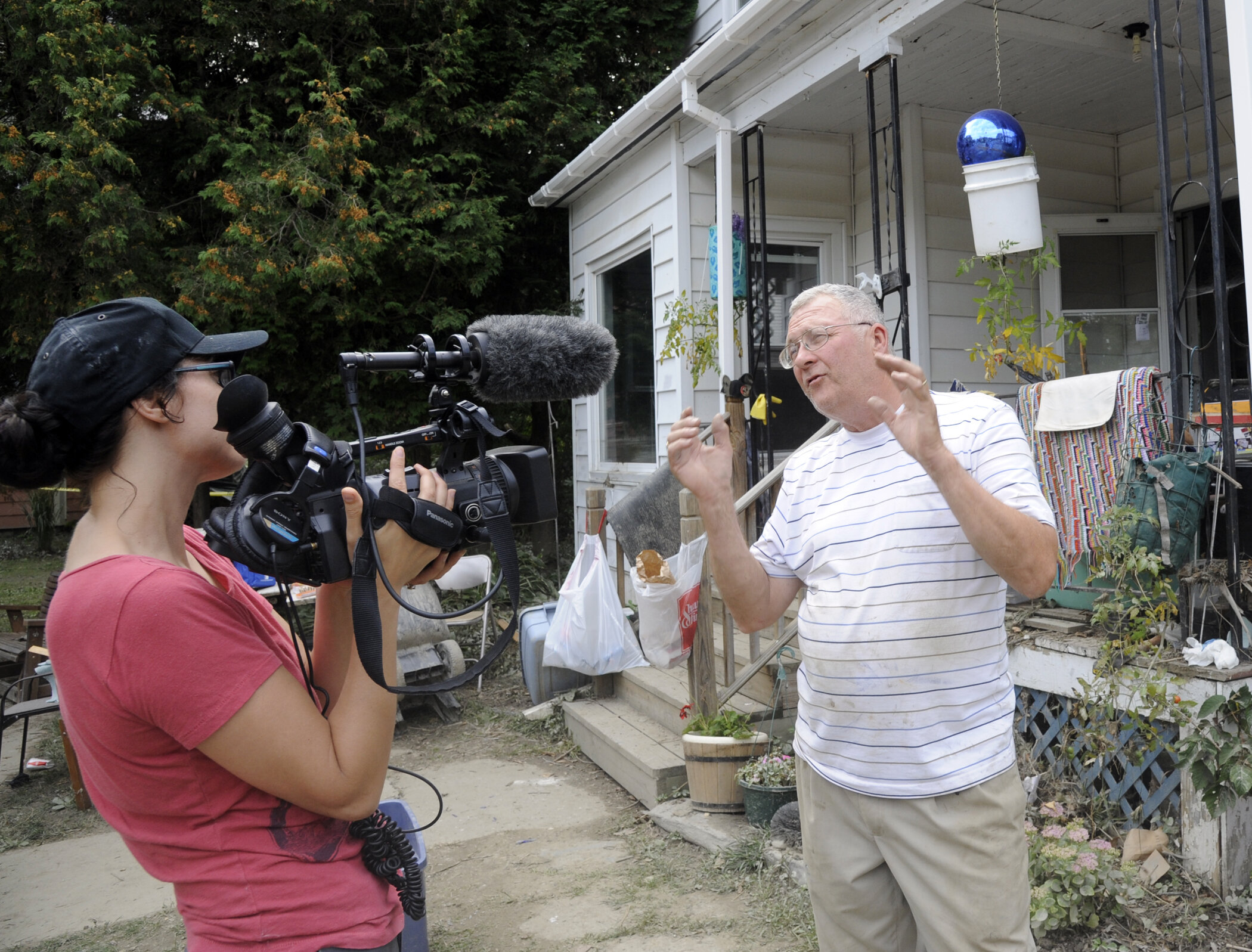  Village trustee and Elm Street resident Skip Flanders gives an interview. Photo by Gordon Miller 
