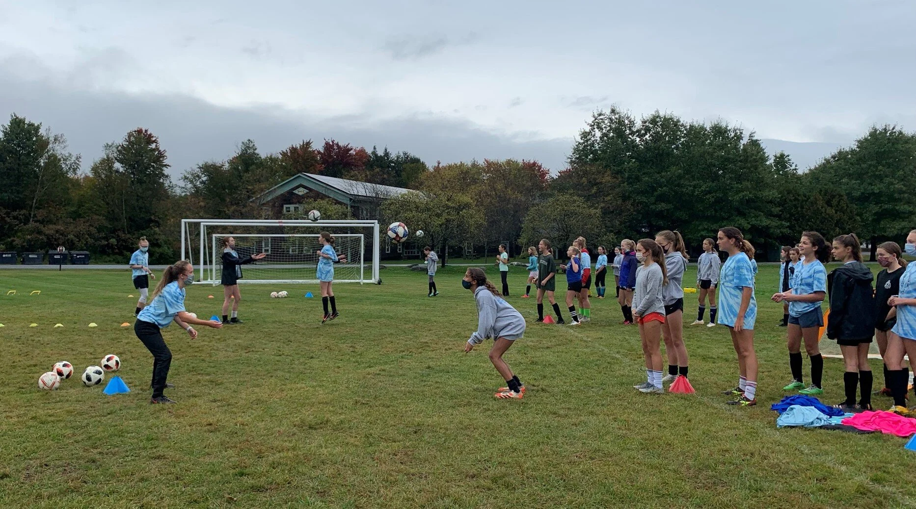   Older middle school players practice easy headers. Photo by Lisa Scagliotti  
