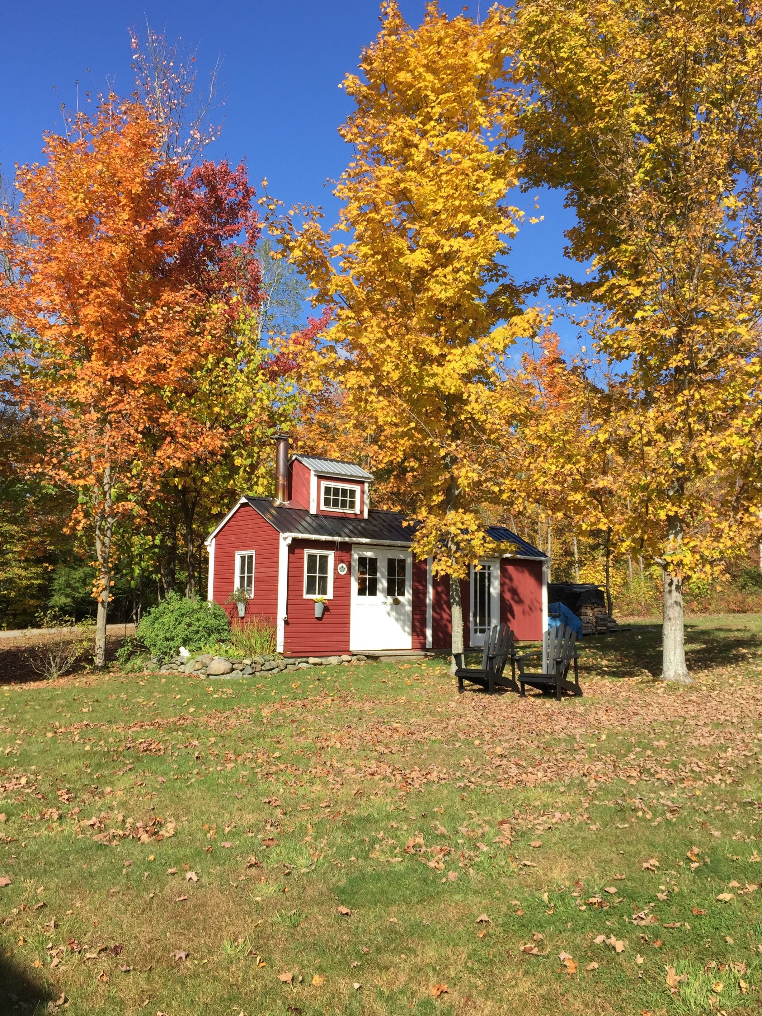   Fall colors light up beside this sugar shack on Ring Road. Photo by Dennis Plante  