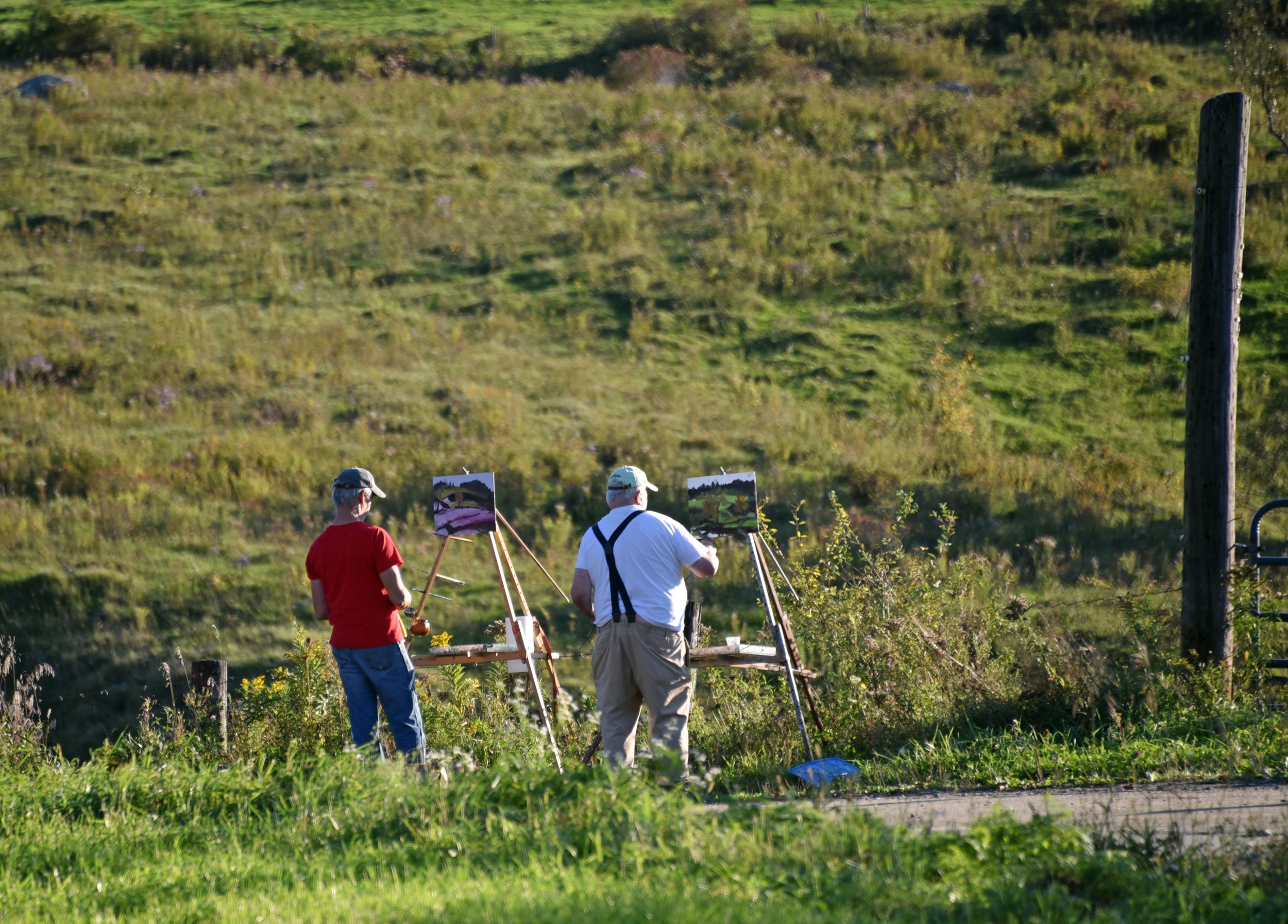   These painters find a quiet spot to create some art in the autumn sunshine on Perry Hill. Photo by Gordon Miller  