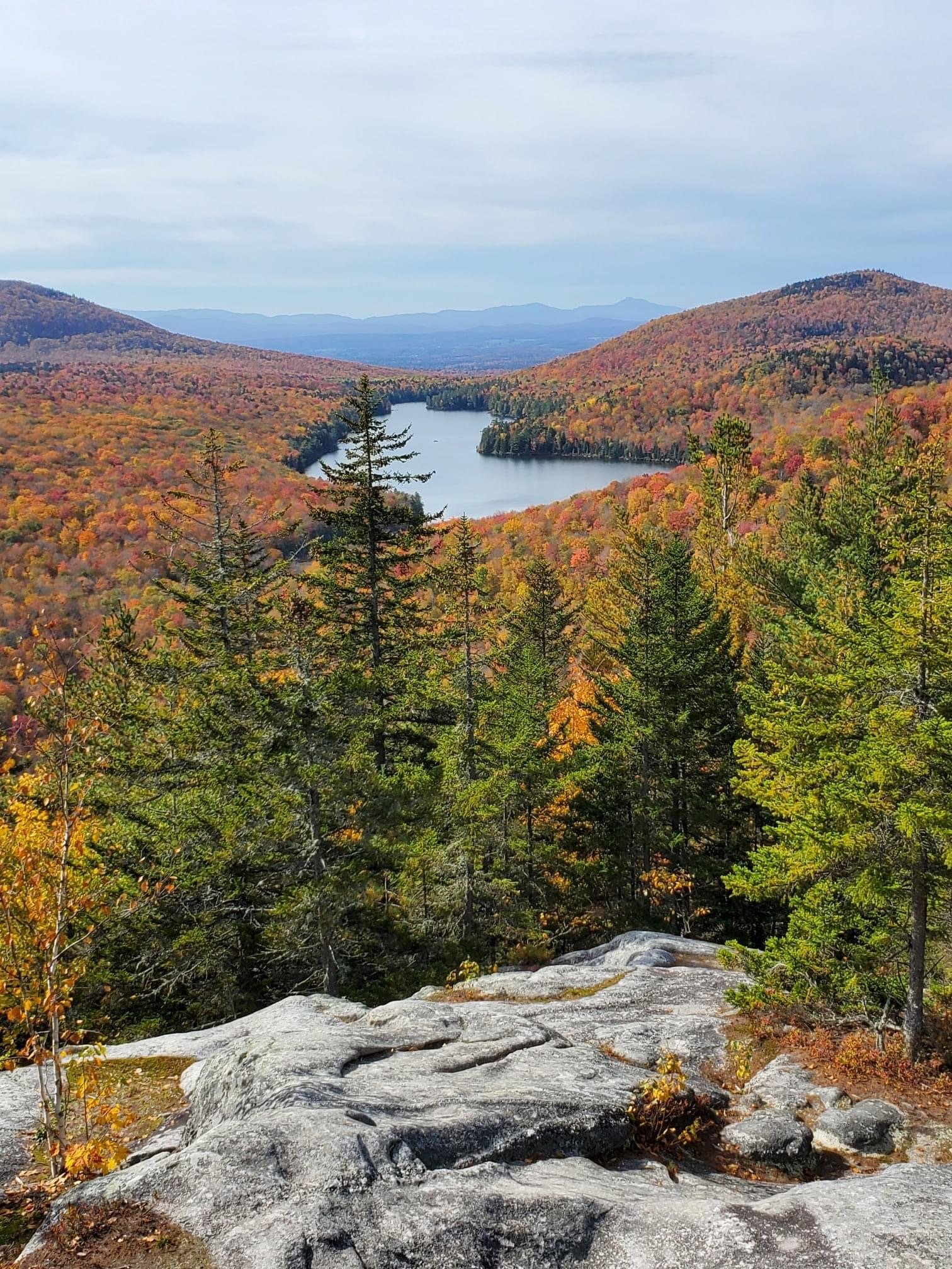   Exploring in Groton State Forest, Steve Lotspeich checked out this view of Kettle Pond from Owl's Head Mountain. Camel's Hump is on the far horizon. 