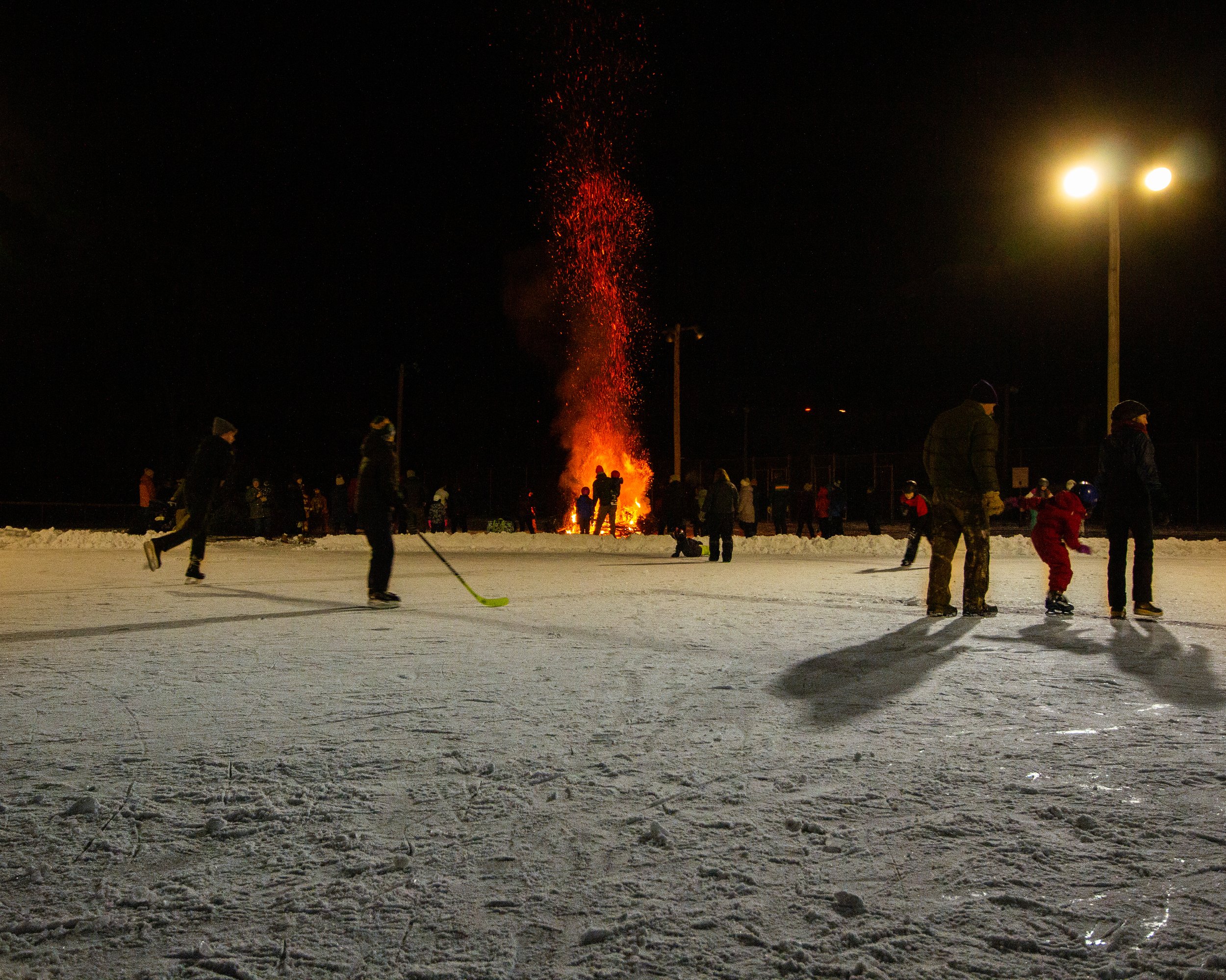  The bonfire is a nice contrast to the outdoor ice rink recently opened at Anderson field. Photo by Tyler Keefe 