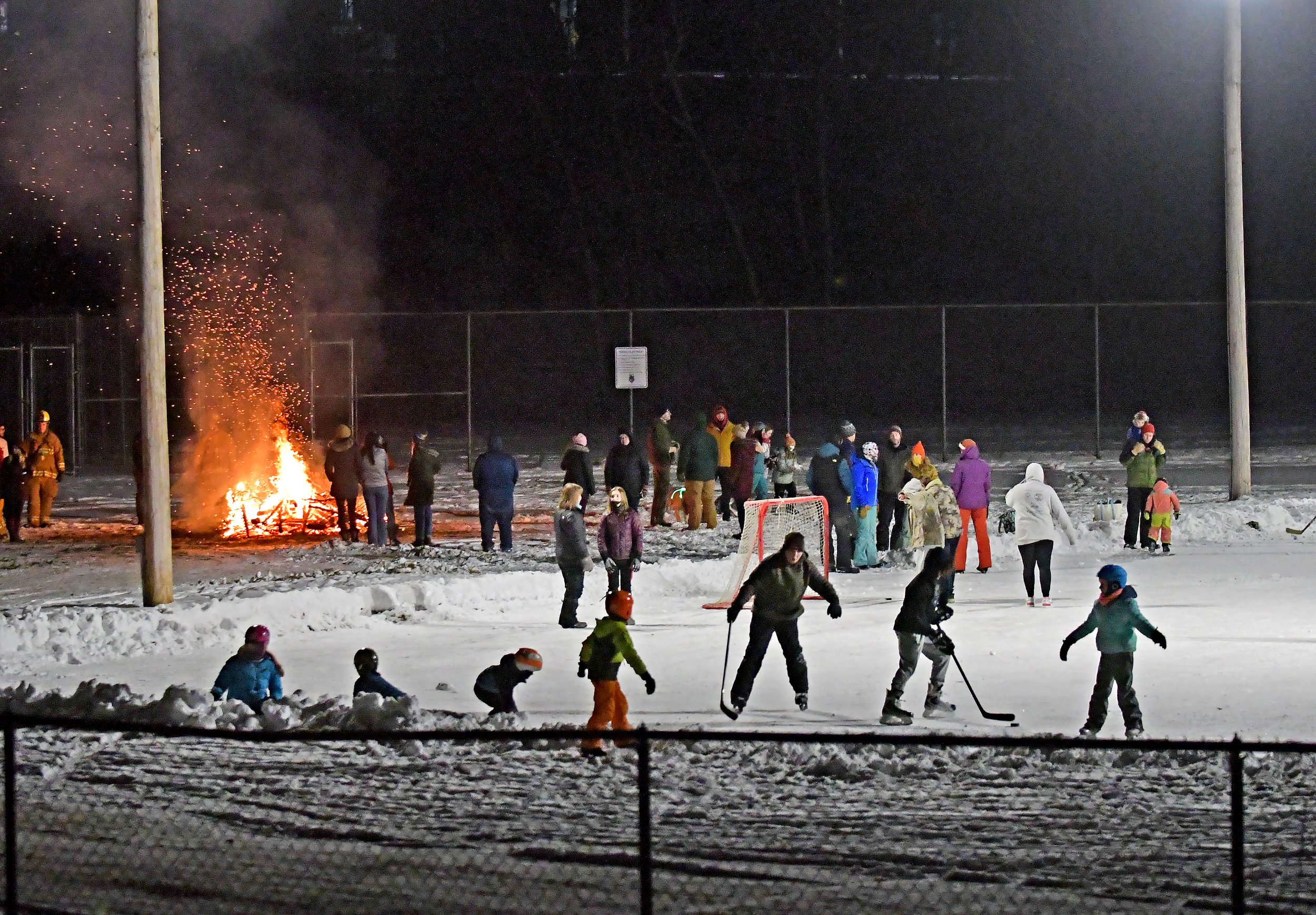  The bonfire attracts a crowd to both the fire and the nearby ice. Photo by Gordon Miller 