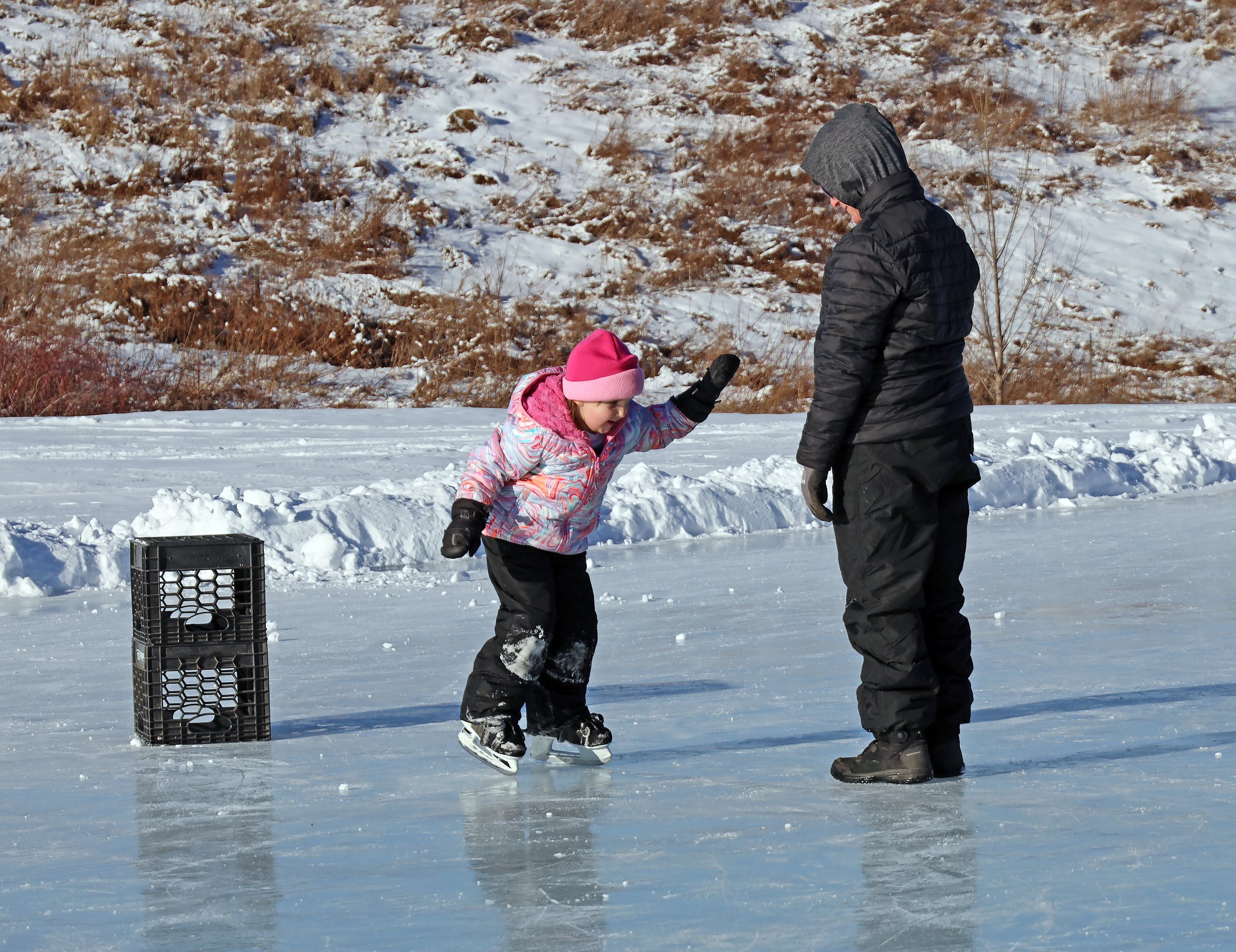  Sarah and Emily Barber do some training at the outdoor rink at Crossett Brook Middle School. Photo by Gordon Miller 