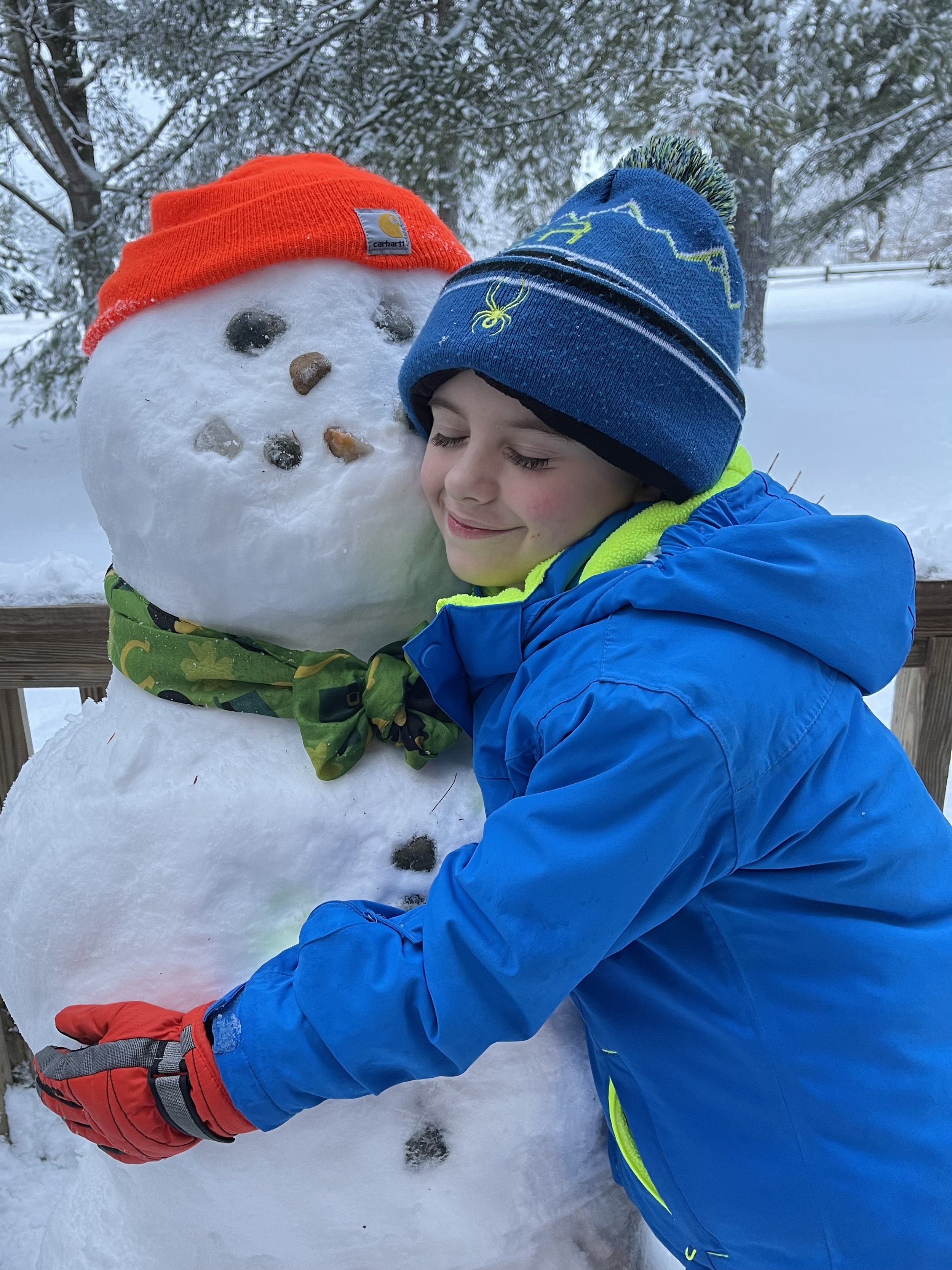   Jaxon discovered perfect snowman snow right out his back door in Stowe. Photo by Nikki Kennedy  