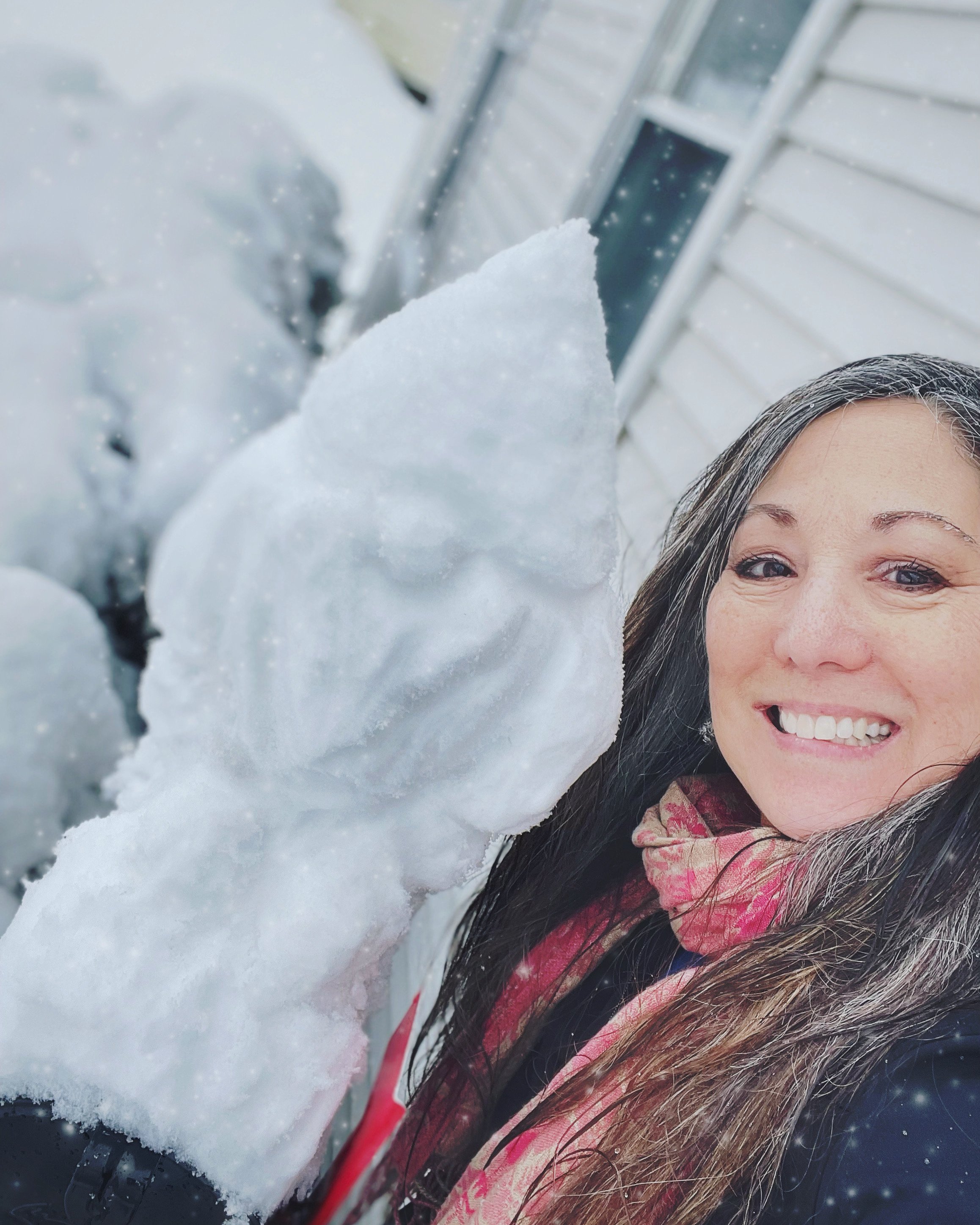   Rene Morse practices her snow-gnome skills. That's a mailbox it's sitting on.  