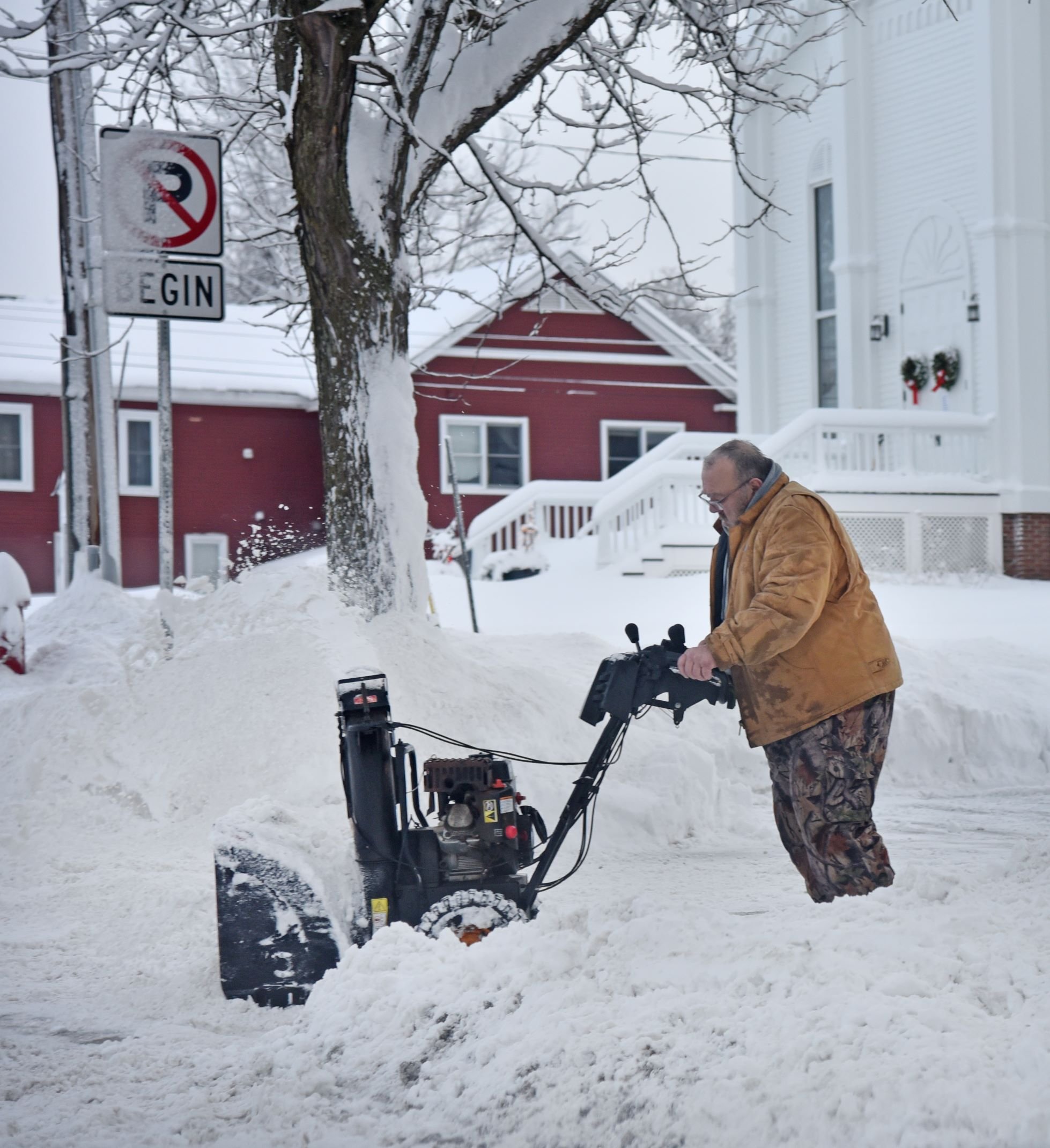  Andy Fuller on North Main fires up the snowblower to clear the driveway near the Congregational Church. Photo by Gordon Miller 