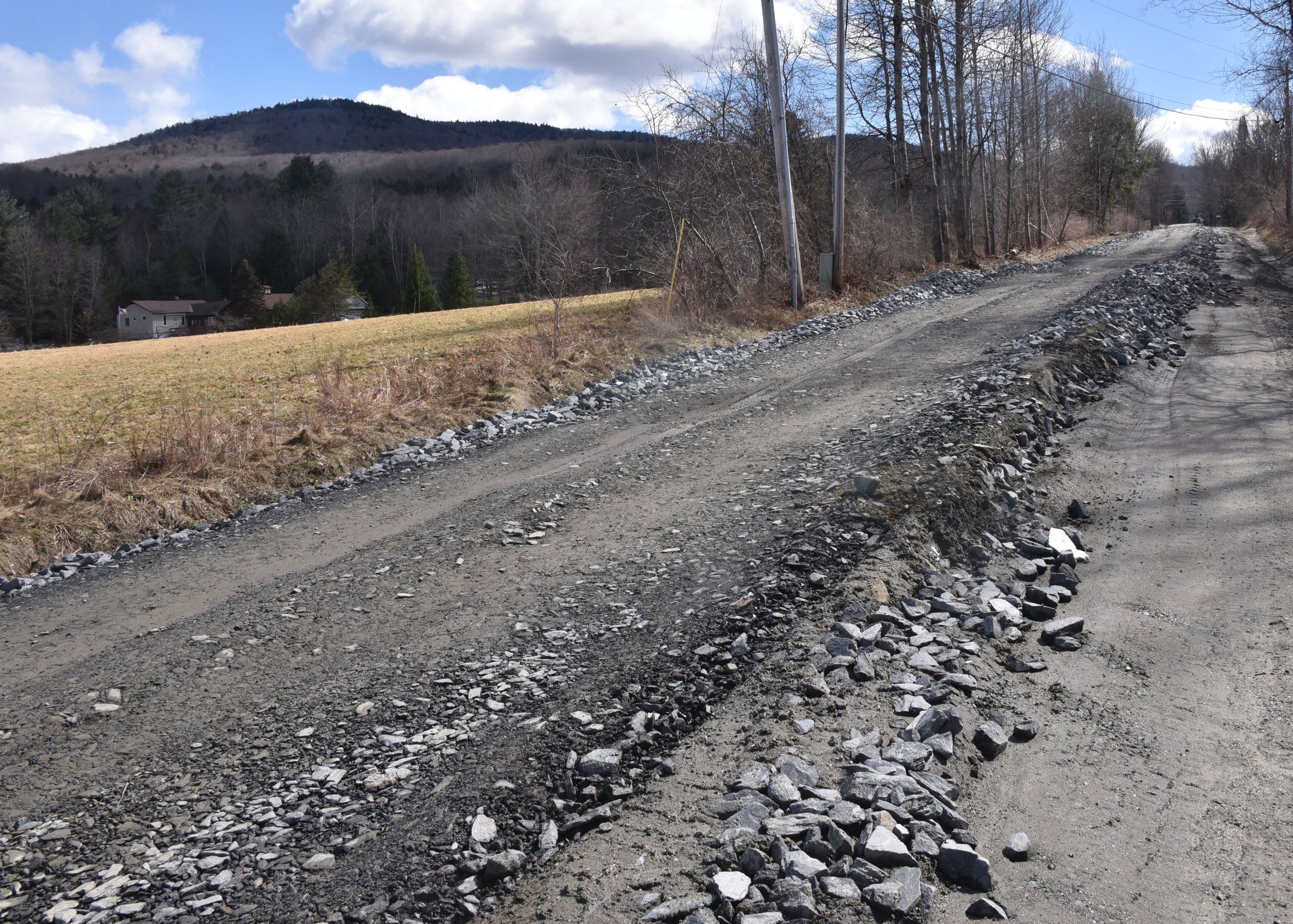  In some cases like this stretch of Perry Hill Road, a single lane is created with road crews planning to return to do the rest. Photo by Gordon Miller 