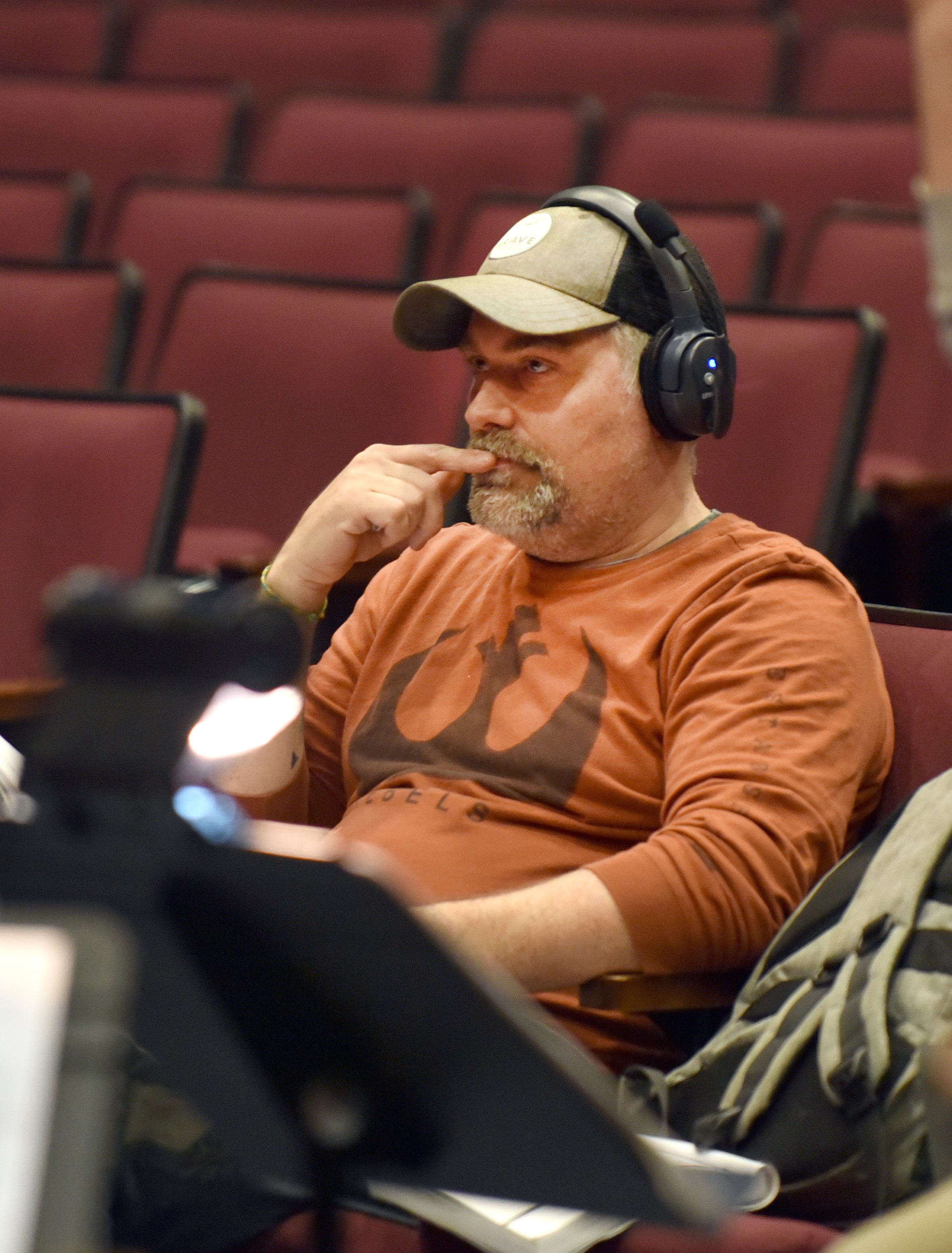   Director Scott Weigand watches as the action unfolds on stage. Photo by Gordon Miller  
