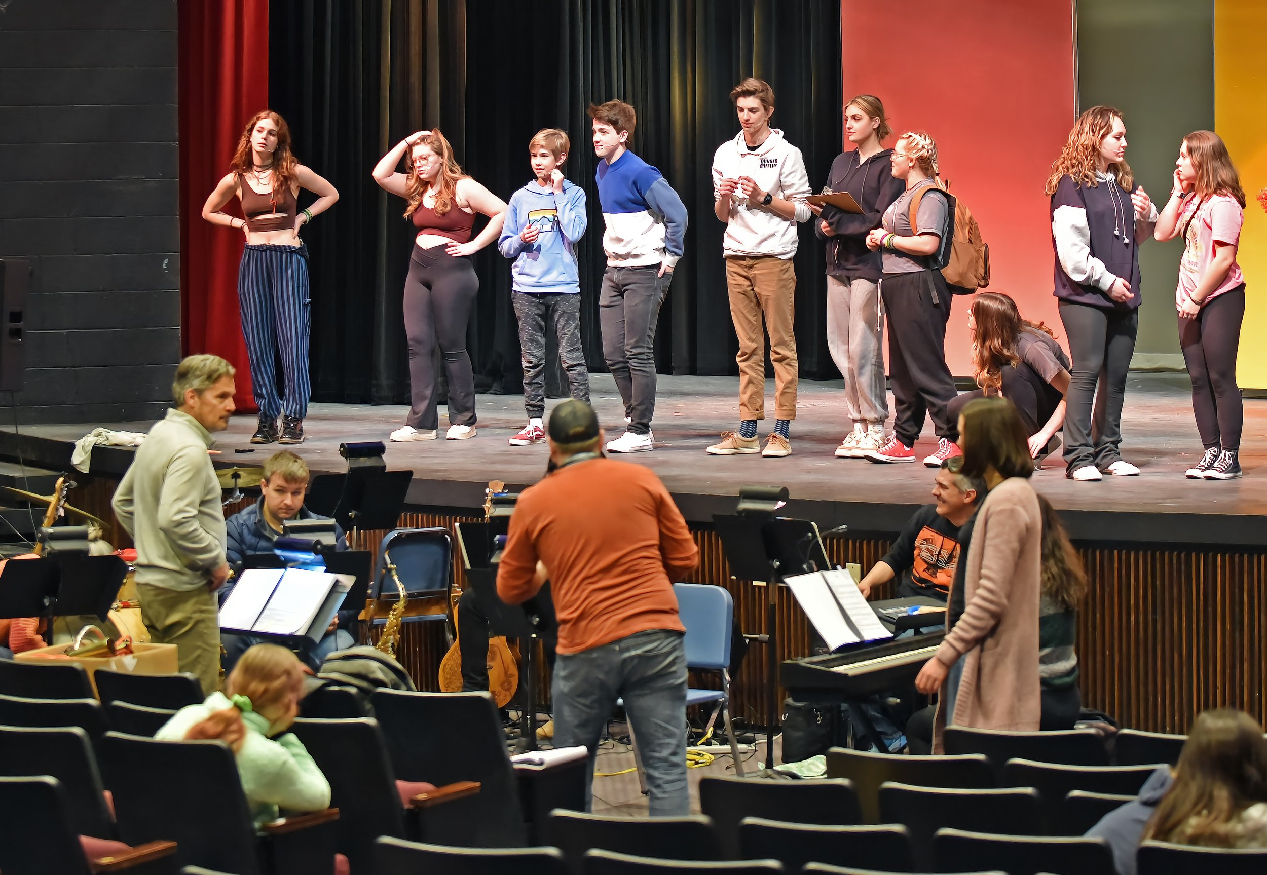   Mic check for cast members during a tech week rehearsal. Photo by Gordon Miller  