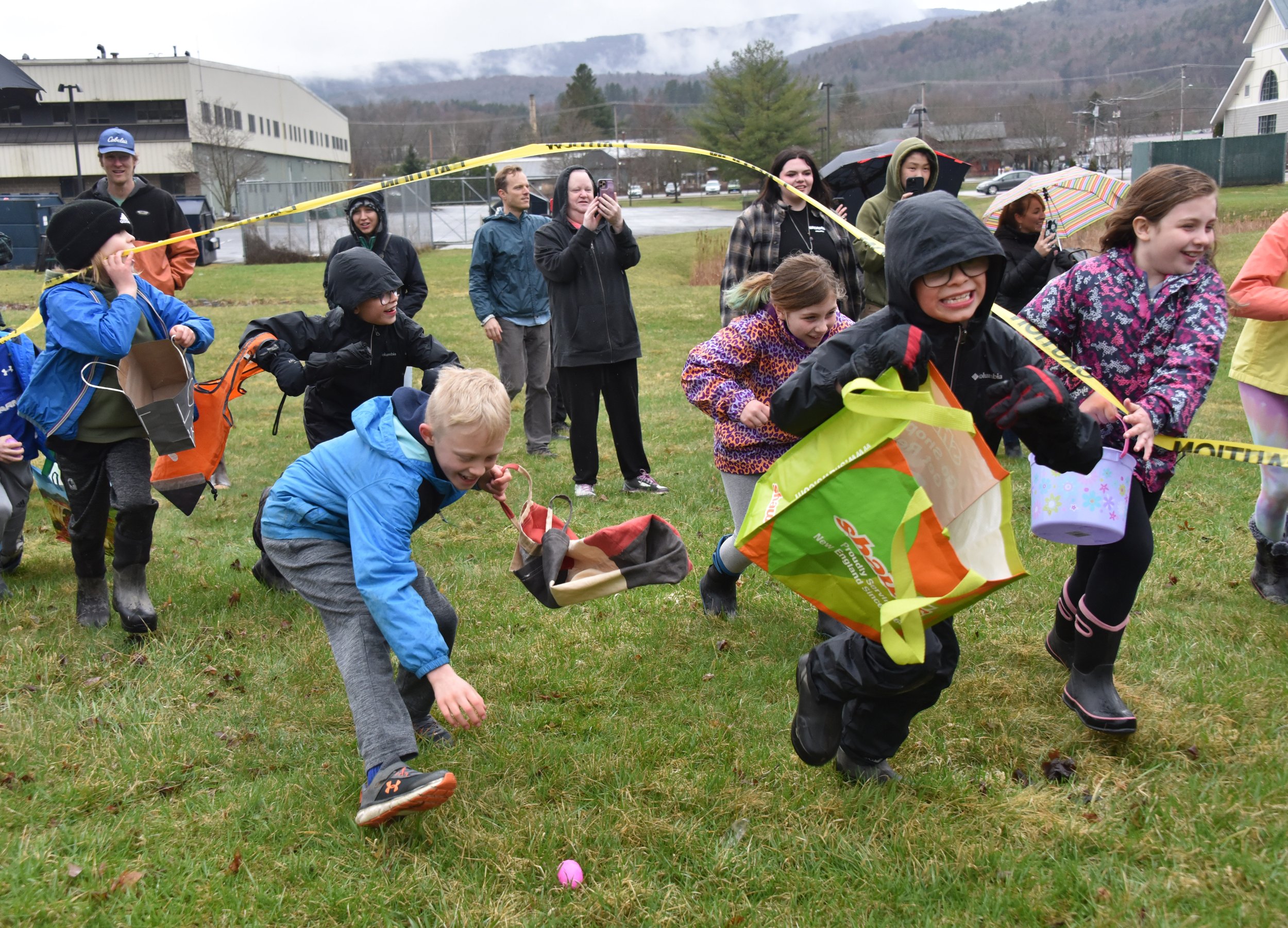  Organizers spent hours stuffing eggs with candy and more than another hour Saturday morning putting thousands of plastic eggs around the field. As usual, the hunt took a matter of minutes. Photo by Gordon Miller 