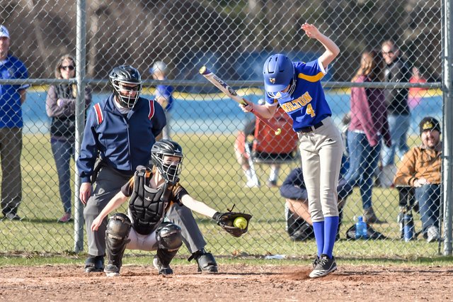   Harwood catcher Chloe Joslin reaches for an outside pitch as Milton's Kylie Agan gets out of the way. Photo by Al Frey  