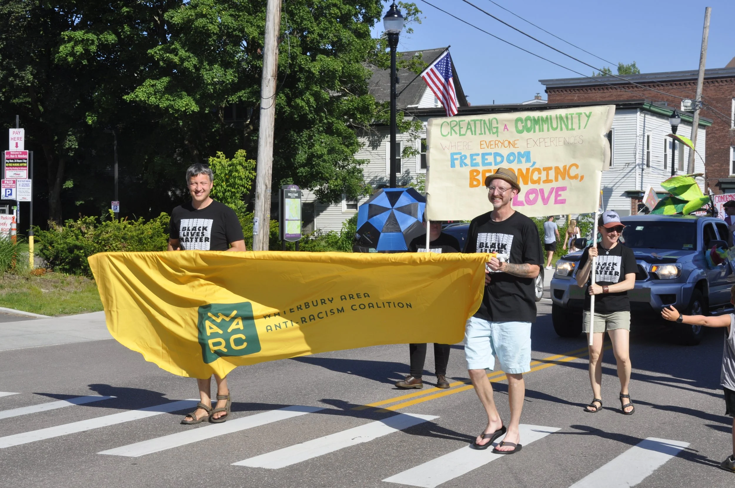  Members of the Waterbury Area Anti-Racism Coalition share messages of racial, social and climate justice and abortion rights. Photo by Lisa Scagliotti 