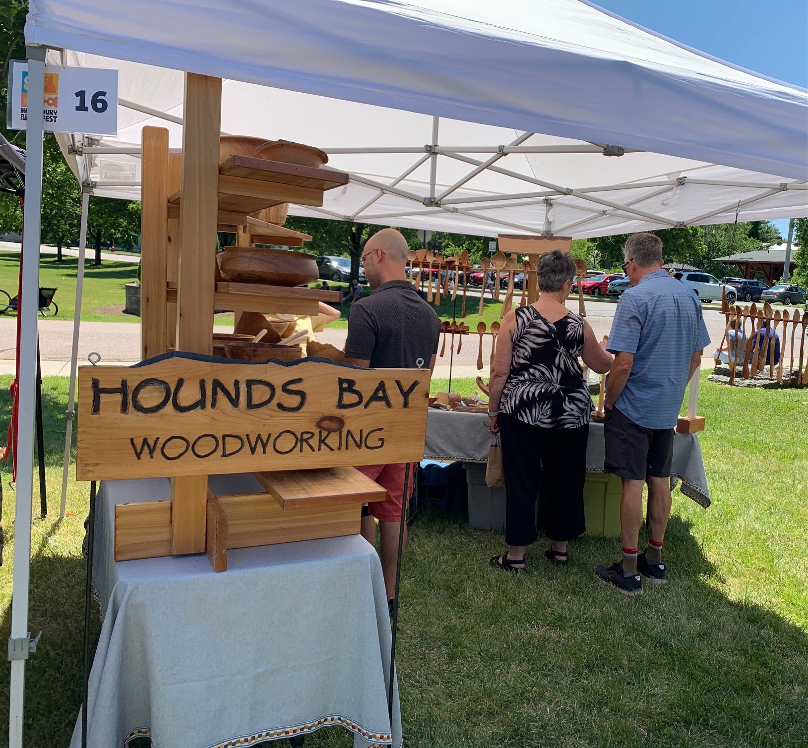  Dennis Gage has a steady stream of people past his stand with wooden bowls, spoons and more. Photo by Lisa Scagliotti 