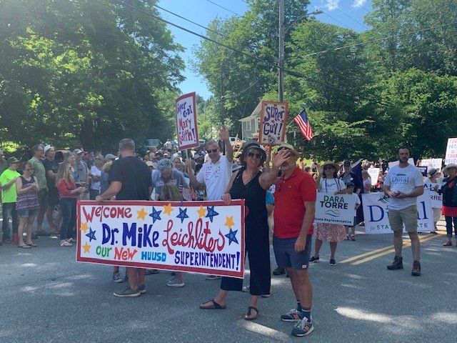  Harwood Unified Union School District’s new Superintendent Mike Leichliter (white shirt) marches with his wife Mary Edith (left), local students, and Warren School Board reps Jonathan Young and Ashley Woods.   