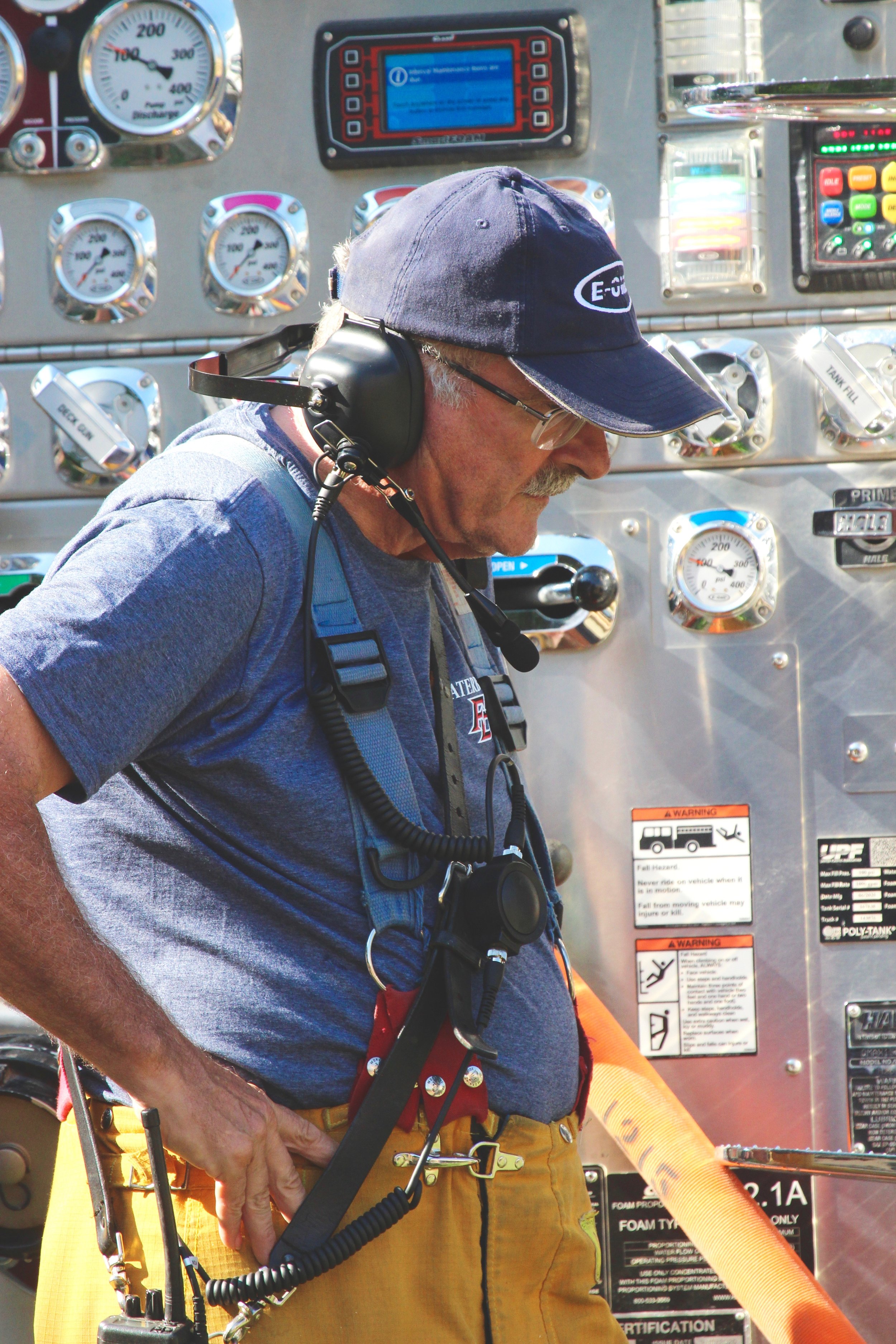   One of Waterbury's senior department members Firefighter Engineer Bob Grace, operating the pump. Photo by René Morse  