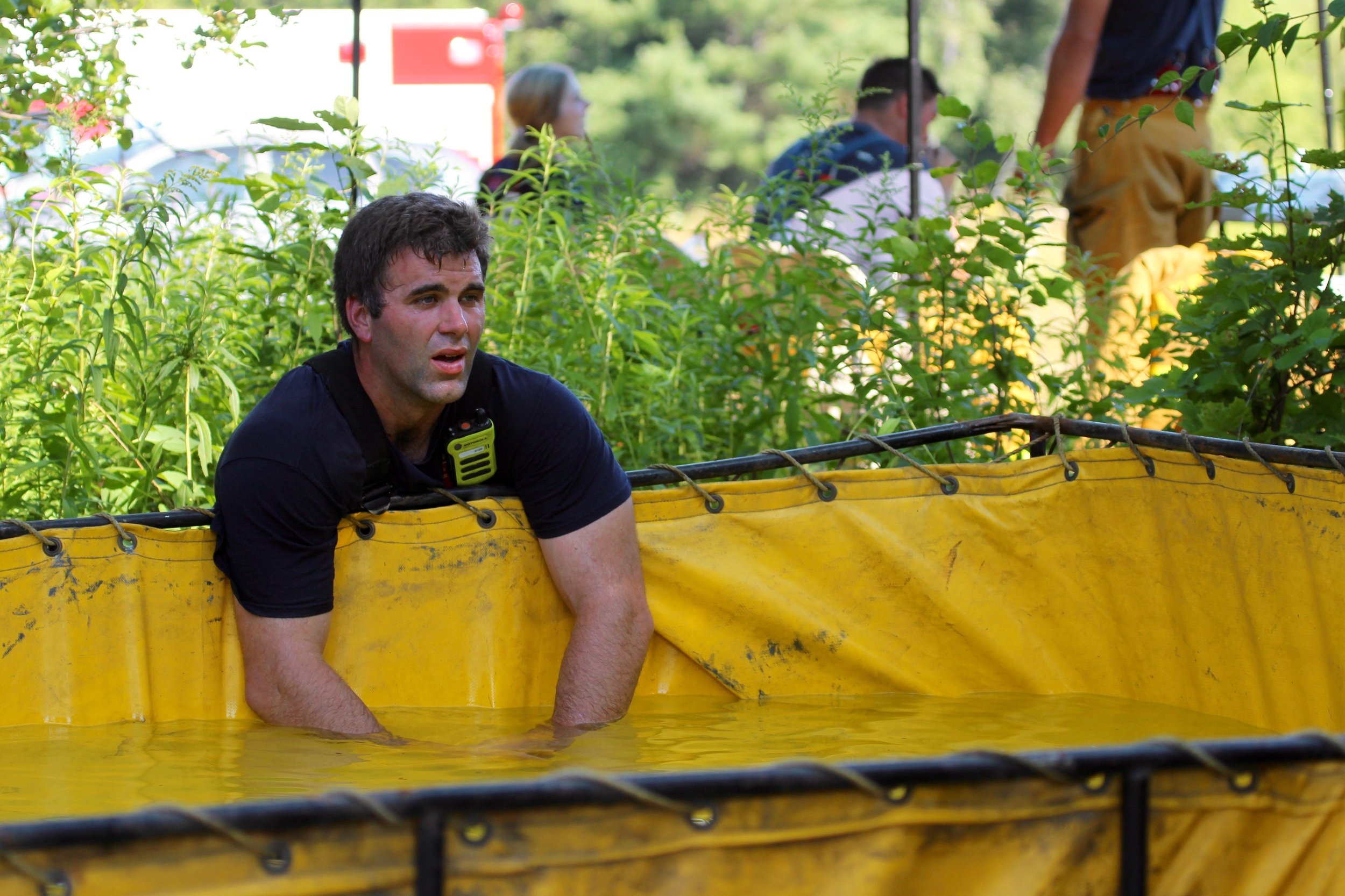  Stowe firefighter Dan Pike cools off. Photo by René Morse   