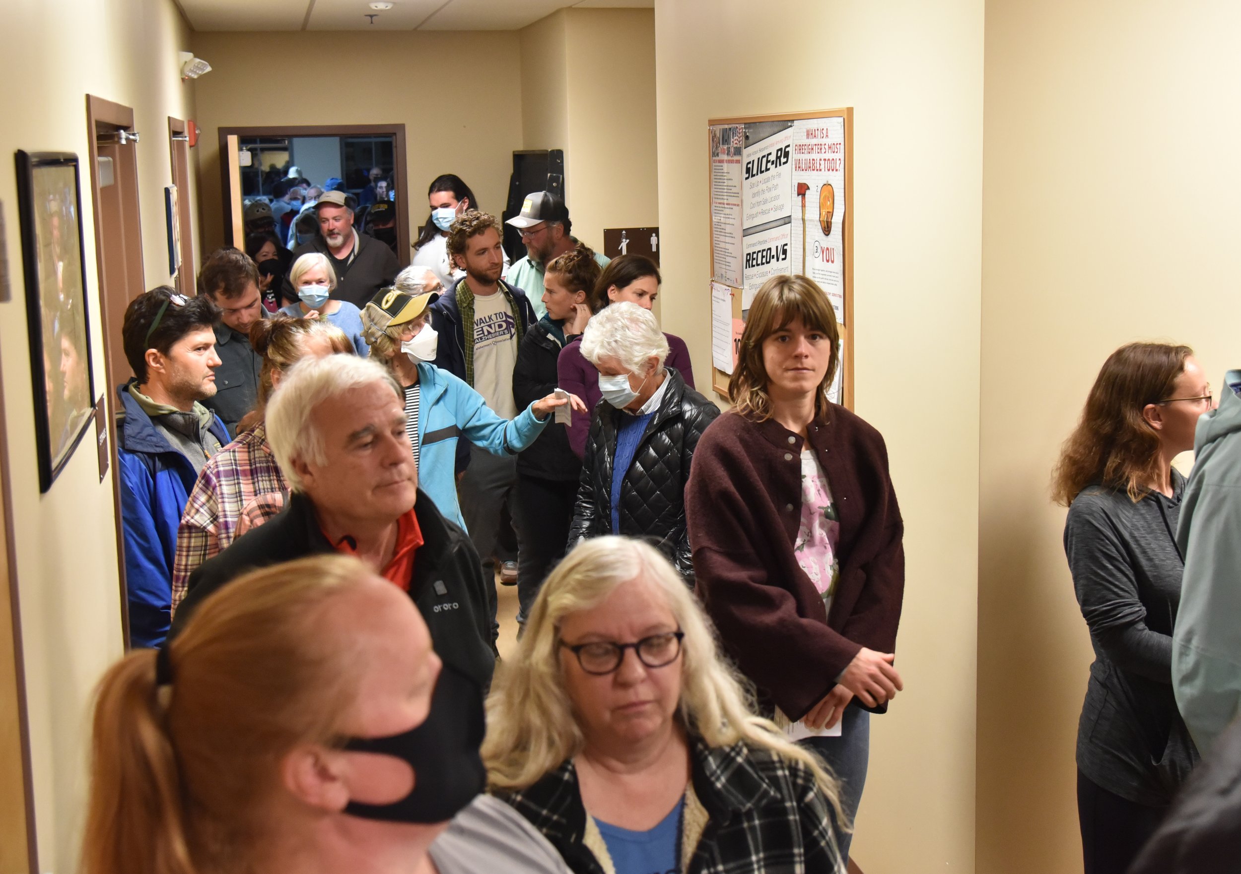   People exited the meeting room in one direction and returned through another door. Photo by Gordon Miller  