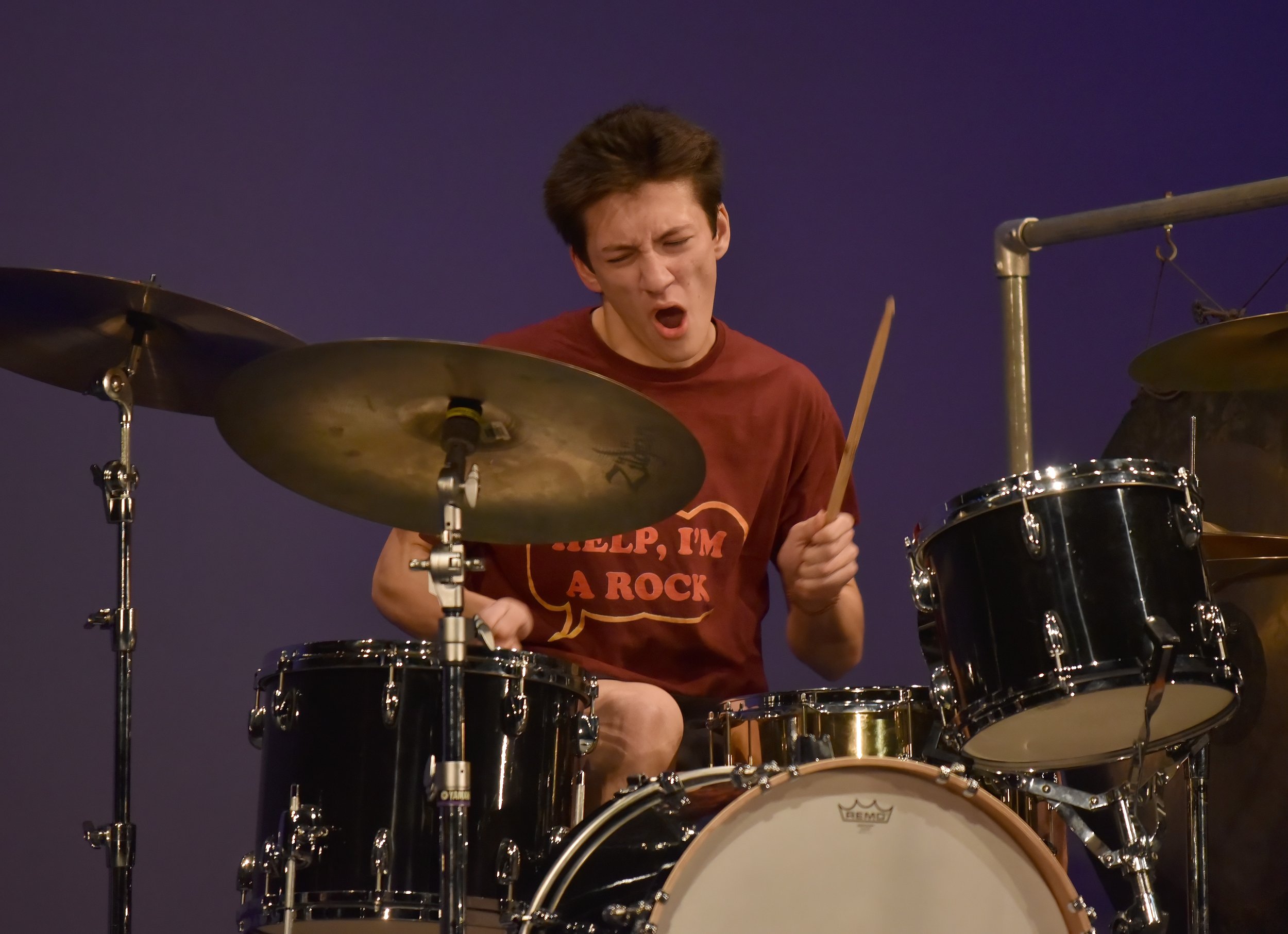   BFA Senior Nicolas Farinaccio drums along to “Burn Down the Mission.” Photo by Gordon Miller  