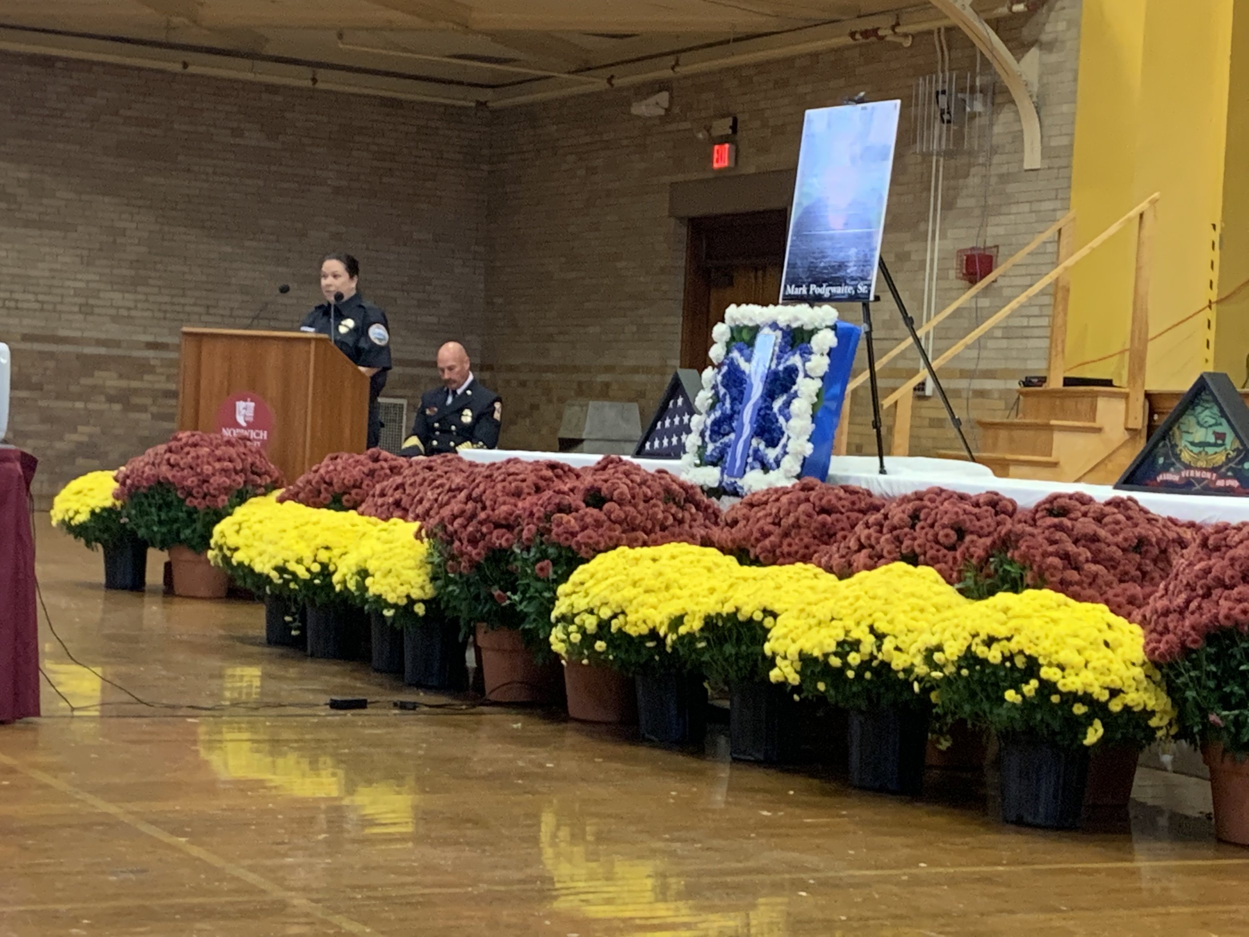  Mark Podgwaite’s colleague Maggie Burke-Greiner, now in the role of interim executive director of Waterbury Ambulance, shares her remarks. Photo by Lisa Scagliotti 