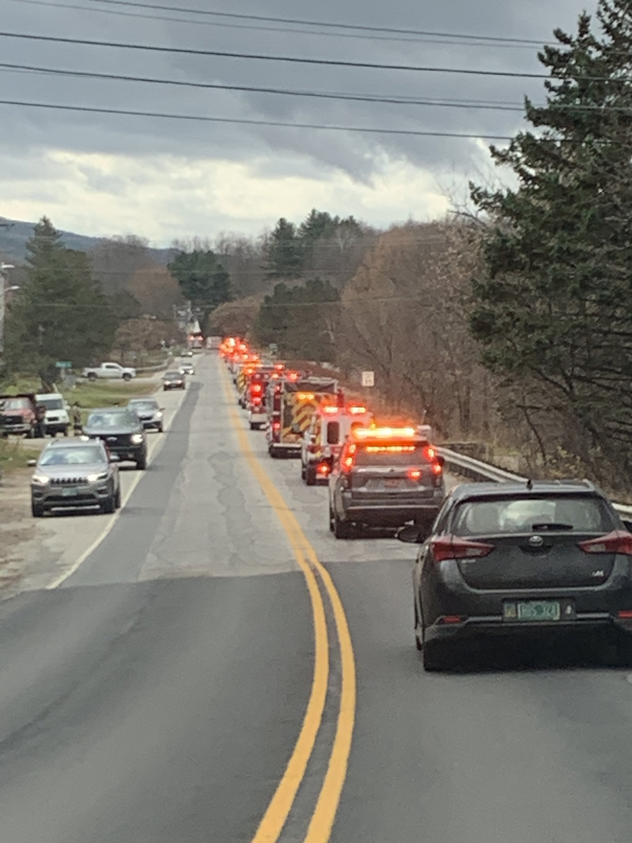  The procession travels down Vermont Route 12 to Northfield. Motorists in the oncoming lane pull to the shoulder as it passes. Photo by Lisa Scagliotti 